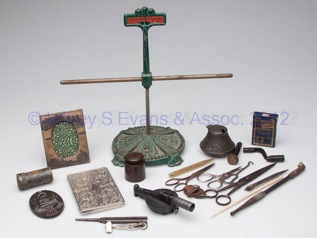 ASSORTED COLLECTIBLES, LOT OF 20: ASSORTED COLLECTIBLES, LOT OF 20, including a folding toleware nutmeg grater, a Chicago Printed String Co. display stand and desk articles. 19th and 20th century. Grater 2 1/2" L. Provenance: From a H
