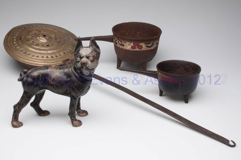 ASSORTED BRASS AND CAST-IRON ARTICLES, LOT OF FOUR: ASSORTED BRASS AND CAST-IRON ARTICLES, LOT OF FOUR, including a bulldog doorstop and a bedwarmer. 19th and 20th century. Warmer 35" L.