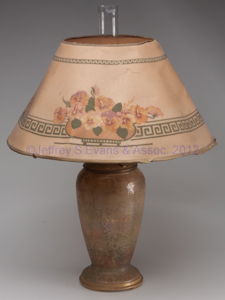 ALADDIN MODEL 12 VASE LAMP: ALADDIN MODEL 12 VASE LAMP, Variegated decoration, satin finish, complete with burner, chimney and parchment shade decorated with violets. 1930-1935. 12" H vase, 20" D shade. Provenance: Property of a