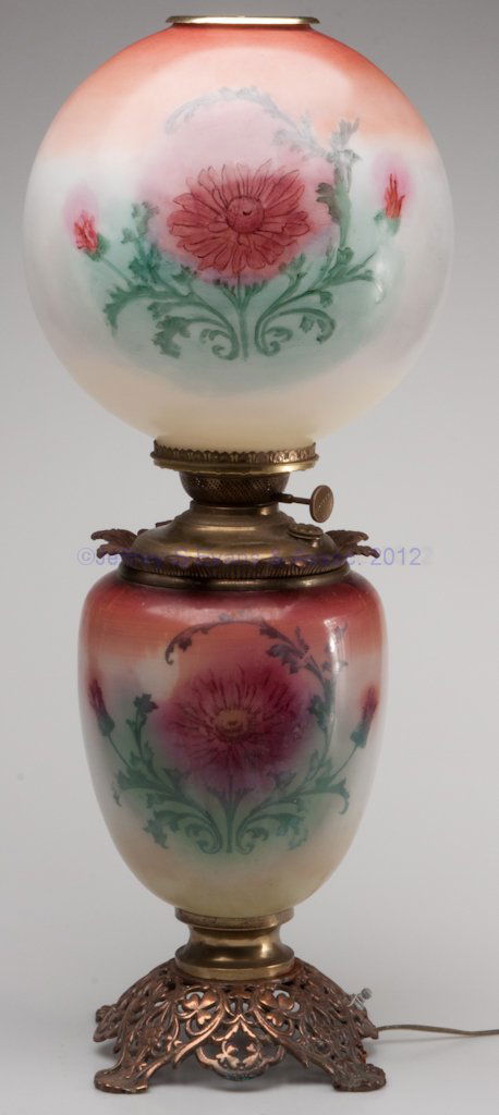 VICTORIAN GONE-WITH-THE-WIND PARLOR LAMP: VICTORIAN GONE-WITH-THE-WIND PARLOR LAMP, decorated opaque white, metal mounts, later ball shade painted to match base. Electrified. Late 19th/early 20th century. 26 1/2" H.