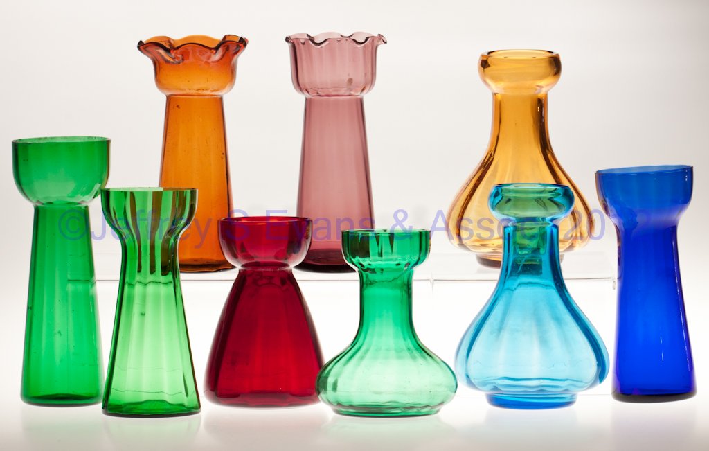 VARIOUS RIB-OPTIC HYACINTH VASES, LOT OF NINE: VARIOUS RIB-OPTIC HYACINTH VASES, LOT OF NINE, various colors, including two with tooled rims. 20th century. 5 3/4" to 8 1/2" H. Provenance: From the collection of Ann Barron McBeth