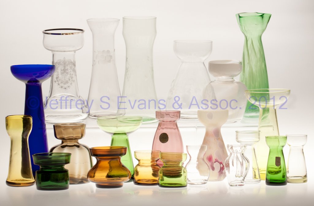 VARIOUS GLASS HYACINTH / CROCUS VASES, LOT OF 22: VARIOUS GLASS HYACINTH / CROCUS VASES, LOT OF 22, various colors, including four engraved/needle etched and three Morgantown Glass Co. candle vases. 20th century. 2 3/8" to 8" H. Provenance: From the