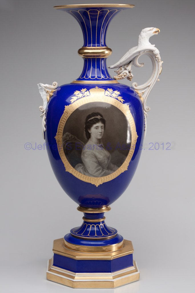 KPM PORCELAIN LARGE BOLTED URN: KPM PORCELAIN LARGE BOLTED URN, cobalt blue and gilt, sepia-tone screened portrait on front, illegible blue under-glaze mark and black orb above KPM over-glaze mark. 20th century. 23 1/2" H. Provenanc