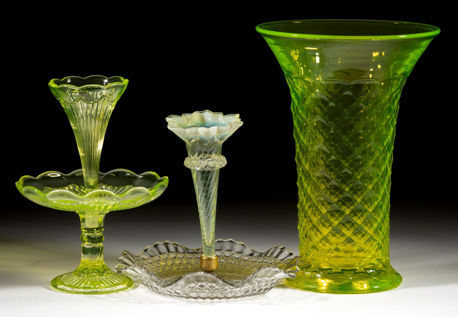 ASSORTED PRESSED VASELINE GLASS VASES, LOT OF THREE: ASSORTED PRESSED VASELINE GLASS VASES, LOT OF THREE, Vaseline (reacts under black light), comprising a very large diamond-patterned trumpet vase and two smaller epergnes, one fit into a colorless