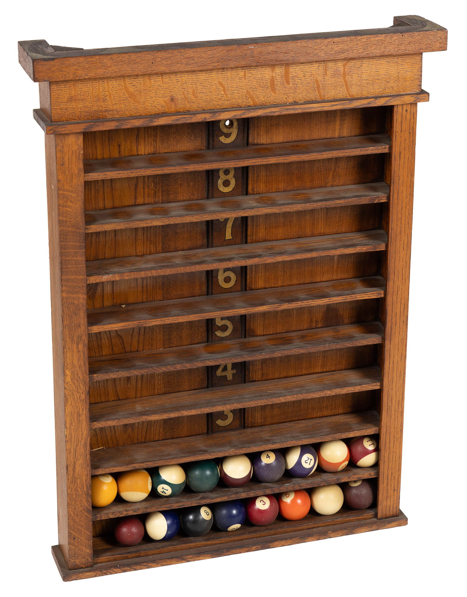 OAK BILLIARD BALL RACK WITH ASSOCIATED BILLIARD BALLS: OAK BILLIARD BALL RACK WITH ASSOCIATED BILLIARD BALLS, golden oak with nine numbered shelves which are slightly curved to hold the balls in place, together with an associated set of pool balls and one