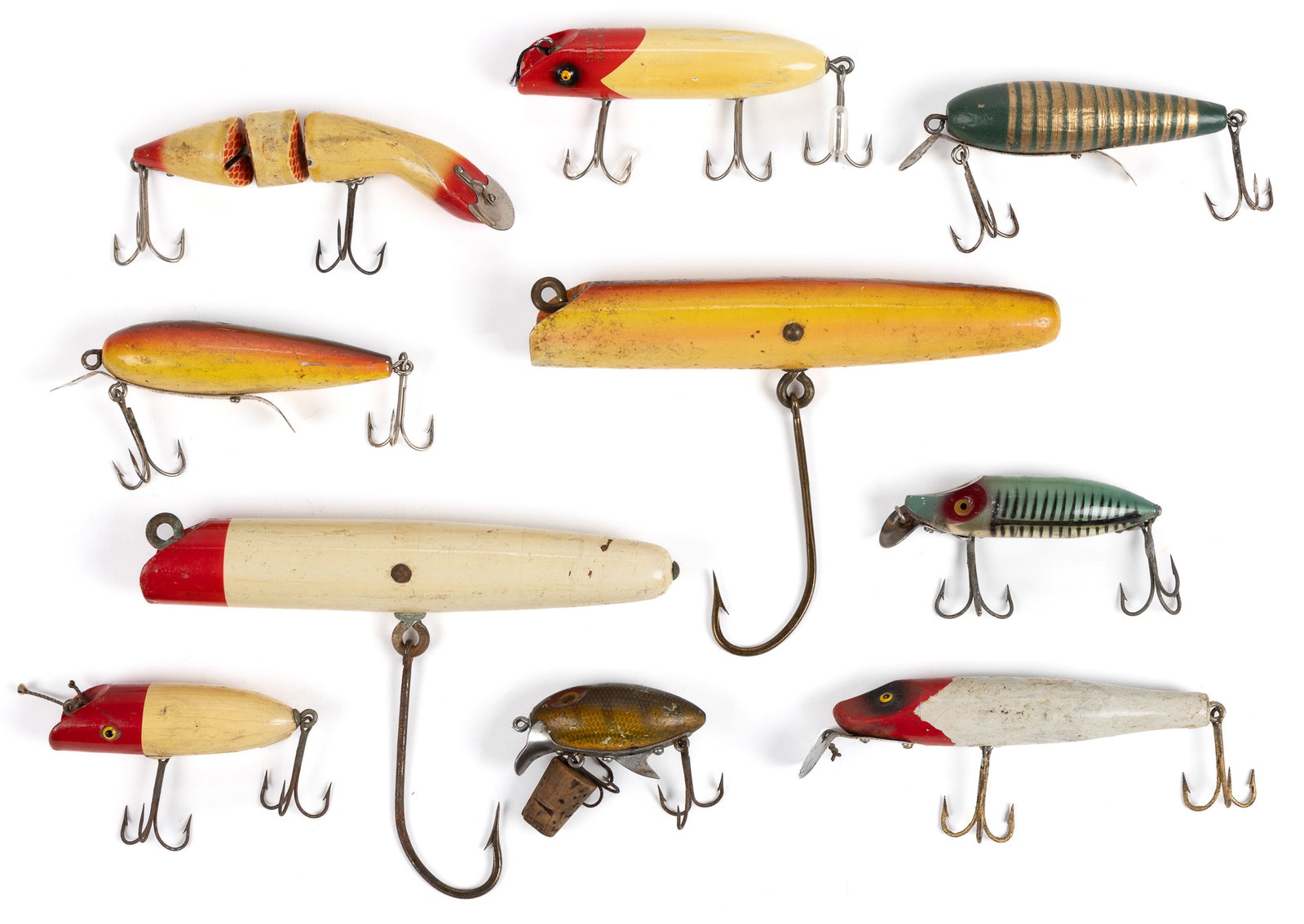 VINTAGE FISHING LURES, LOT OF TEN: VINTAGE FISHING LURES, LOT OF TEN, wood and plastic lures, comprising four examples by South Bend Bait Co. of a red-and-white Bass-Oreno with glass eyes, a red-and-white Babe-Oreno with glass eye