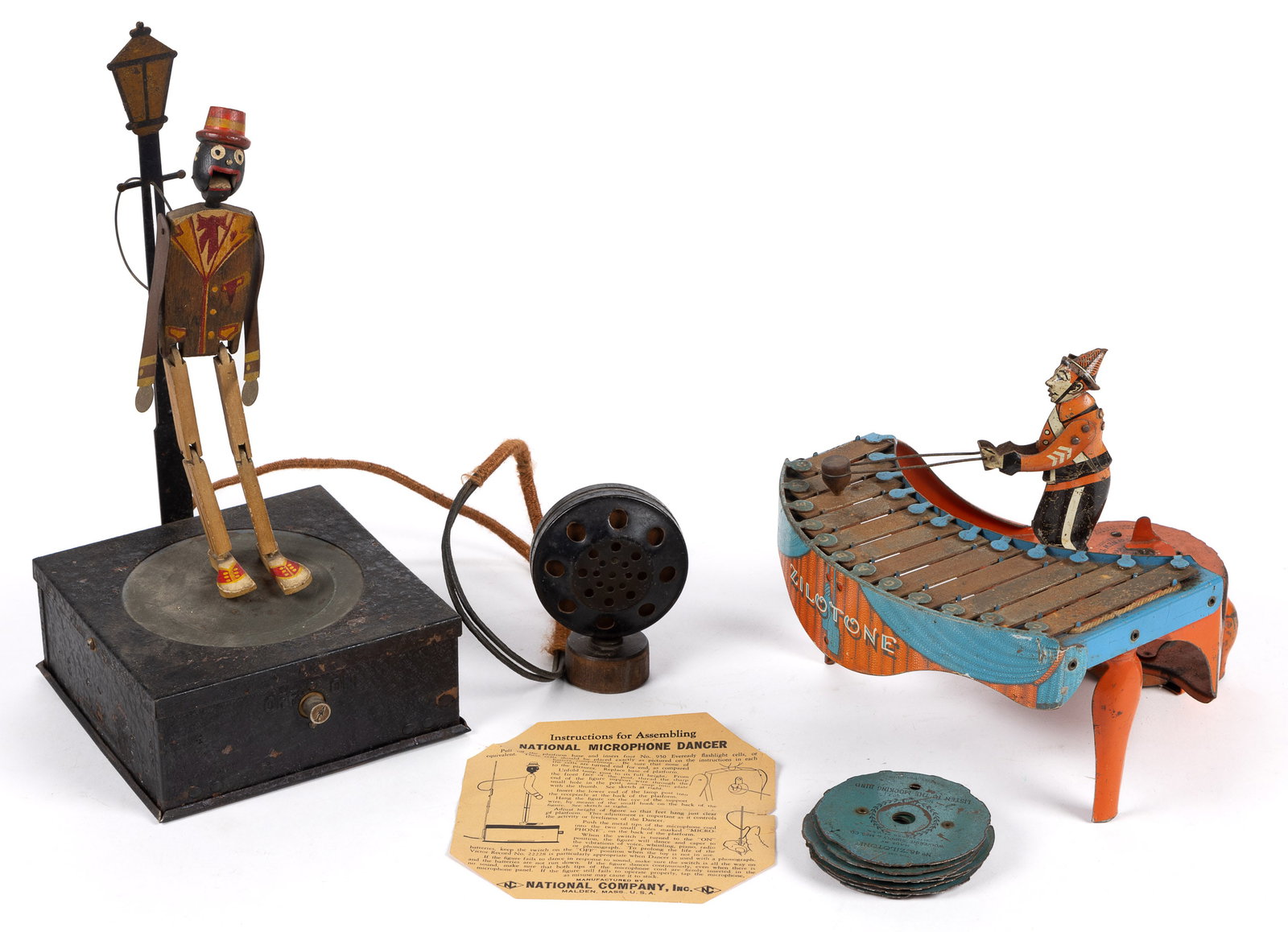 NATIONAL COMPANY MICROPHONE DANCING SAM AND WOLVERINE ZILOTONE, LOT OF TWO: NATIONAL COMPANY MICROPHONE DANCING SAM AND WOLVERINE ZILOTONE, LOT OF TWO, lithographed tin and painted wood, Dancing Sam toy battery operated, includes original instruction paper, Zilotone