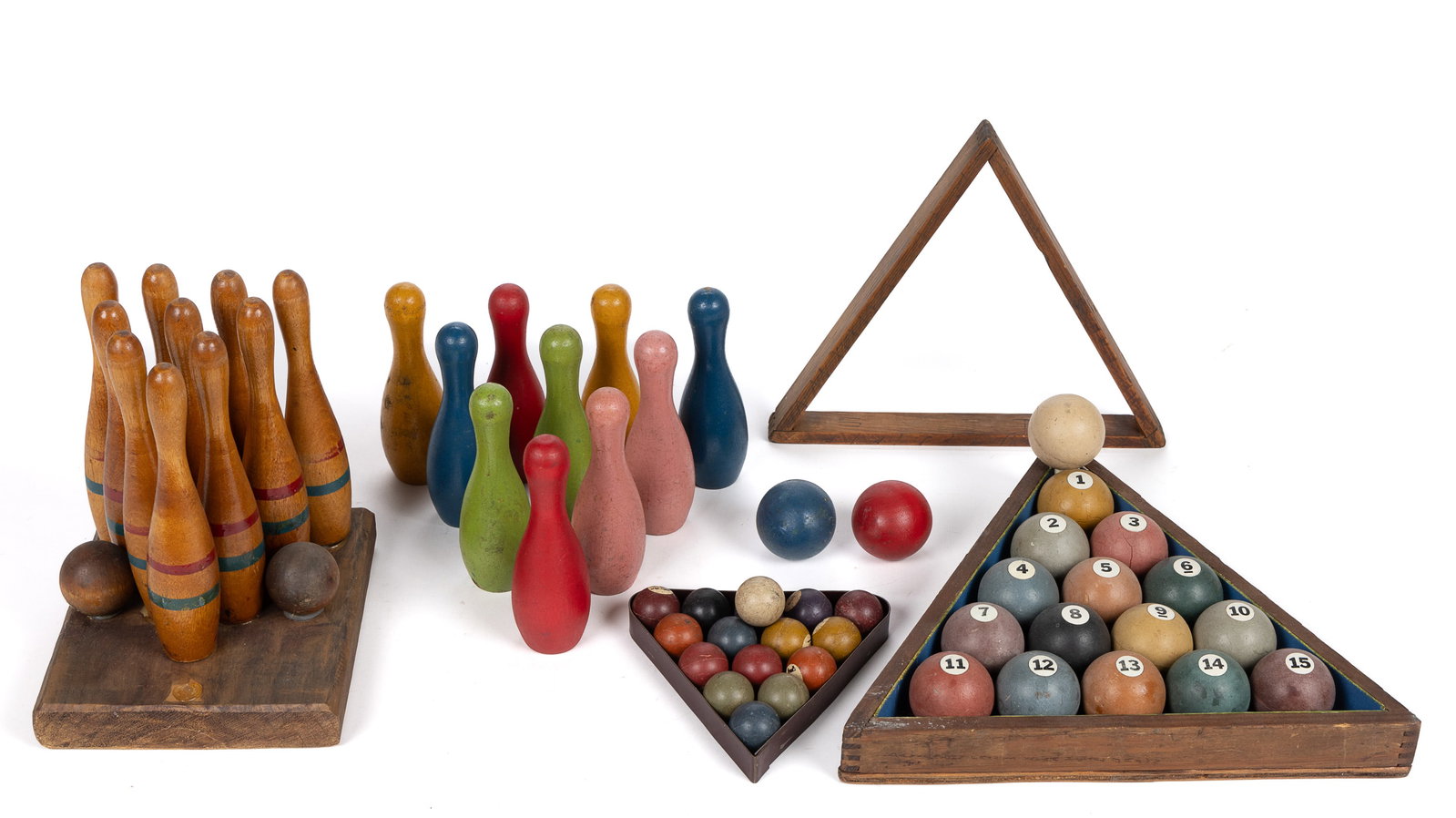 MINIATURE BOWLING BALLS / PINS AND BILLIARDS BALLS, LOT OF 44: MINIATURE BOWLING BALLS / PINS AND BILLIARDS BALLS, LOT OF 44, comprising a miniature billiards set with metal frame, a wooden frame, a decorative wall-hanging billiards set, and two sets of bowling p
