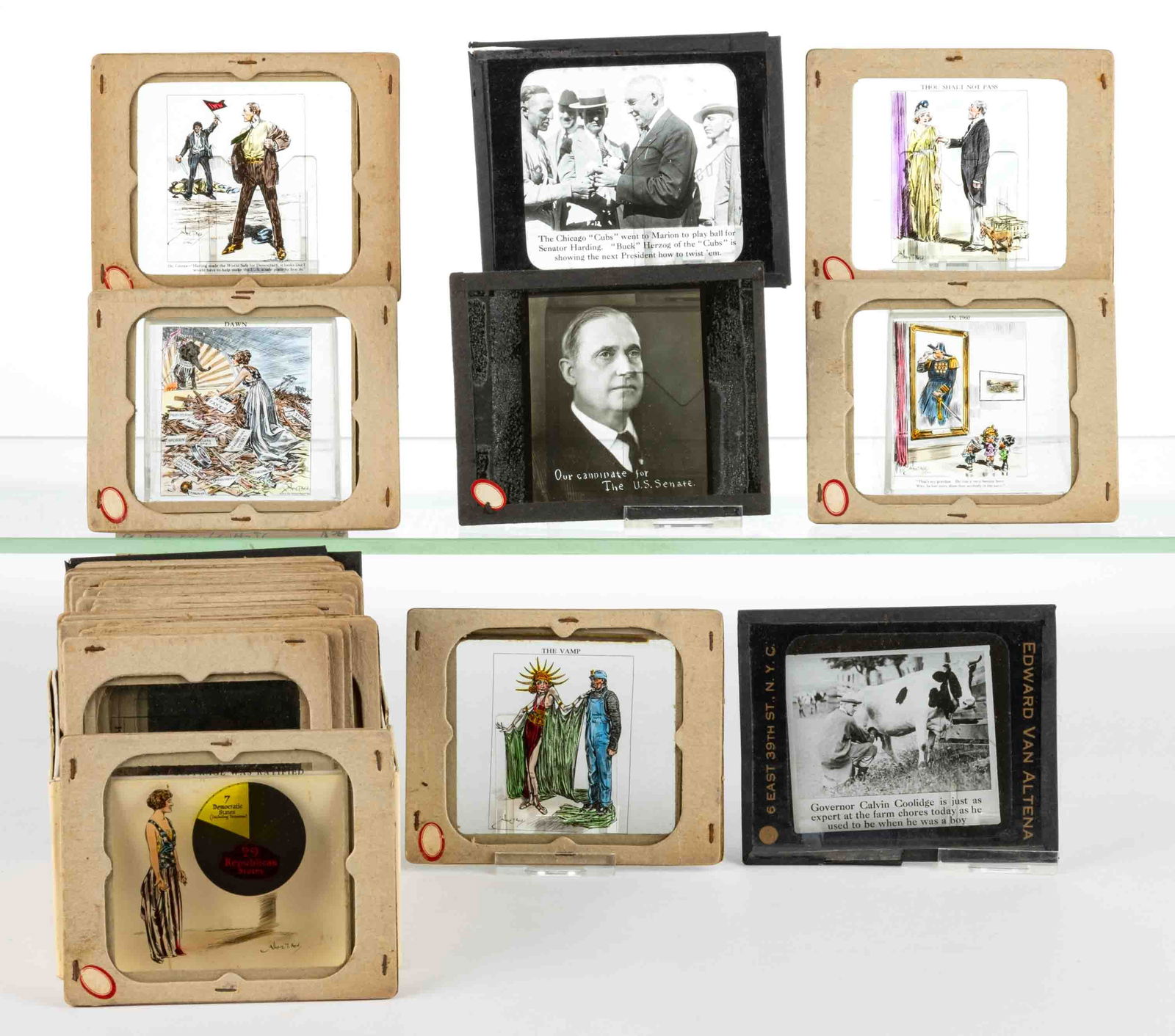 ALBERT T. REID POLITICAL CARTOON MAGIC LANTERN SLIDES, LOT OF 31: ALBERT T. REID POLITICAL CARTOON MAGIC LANTERN SLIDES, LOT OF 31, consisting of a set of political cartoons by the artist Albert T. Reid, several of which depict suffrage subjects, and many other Wood