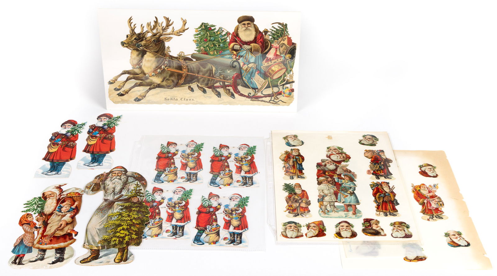 VICTORIAN LITHOGRAPHED CHRISTMAS DIE-CUTS, LOT OF 36: VICTORIAN LITHOGRAPHED CHRISTMAS DIE-CUTS, LOT OF 36, each depicting Santa Claus, one in a sleigh with toys being pulled by reindeer. Together with a plain cut-out example. Thirty-seven (37) piec