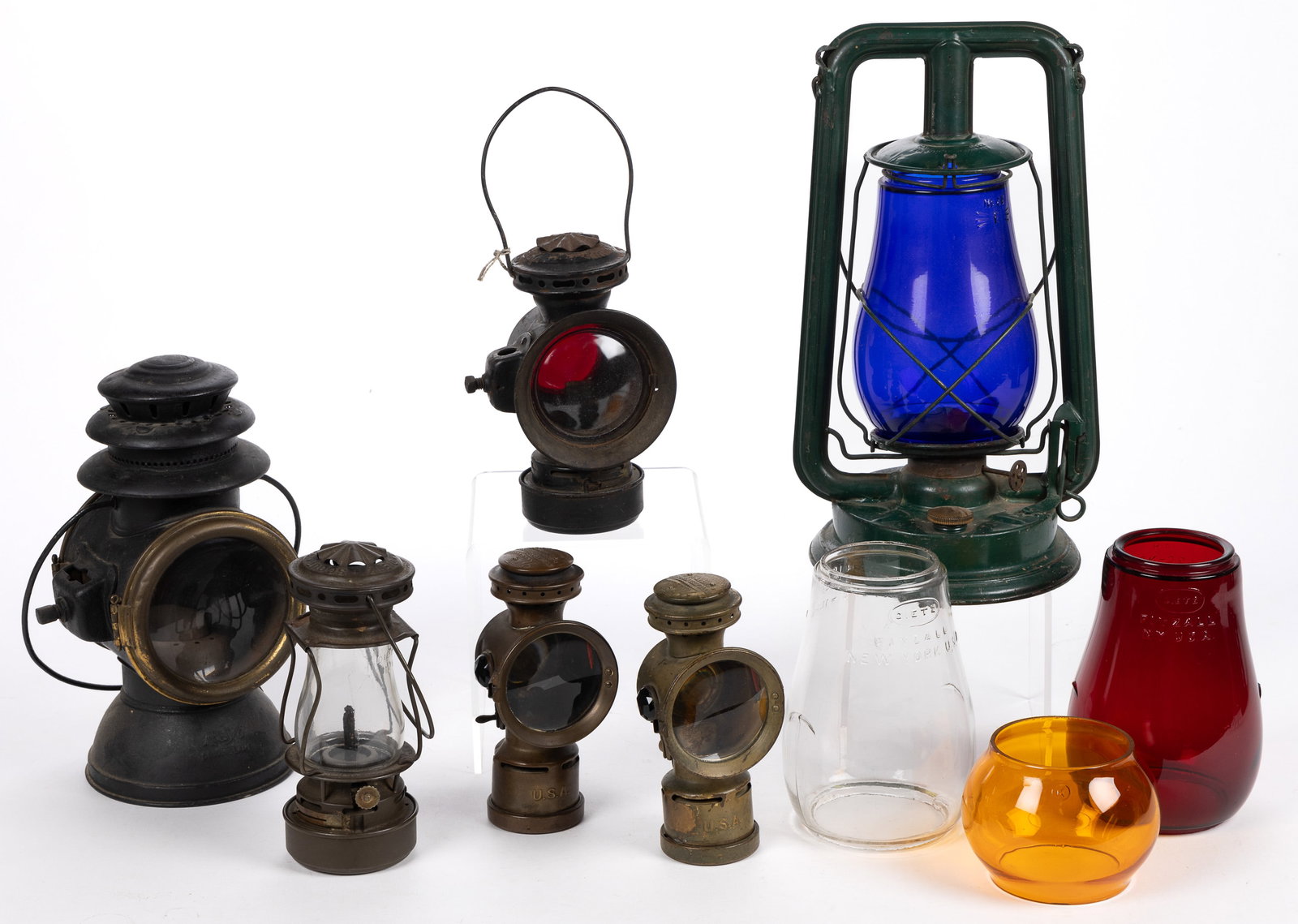 ASSORTED KEROSENE LANTERNS / GLOBES, LOT OF NINE: ASSORTED KEROSENE LANTERNS / GLOBES, LOT OF NINE, including two examples by Dietz, one by Paull's, two called Neverout by the Rose Mfg. Co. of Philadelphia, one example by Rayo, two Dietz glo