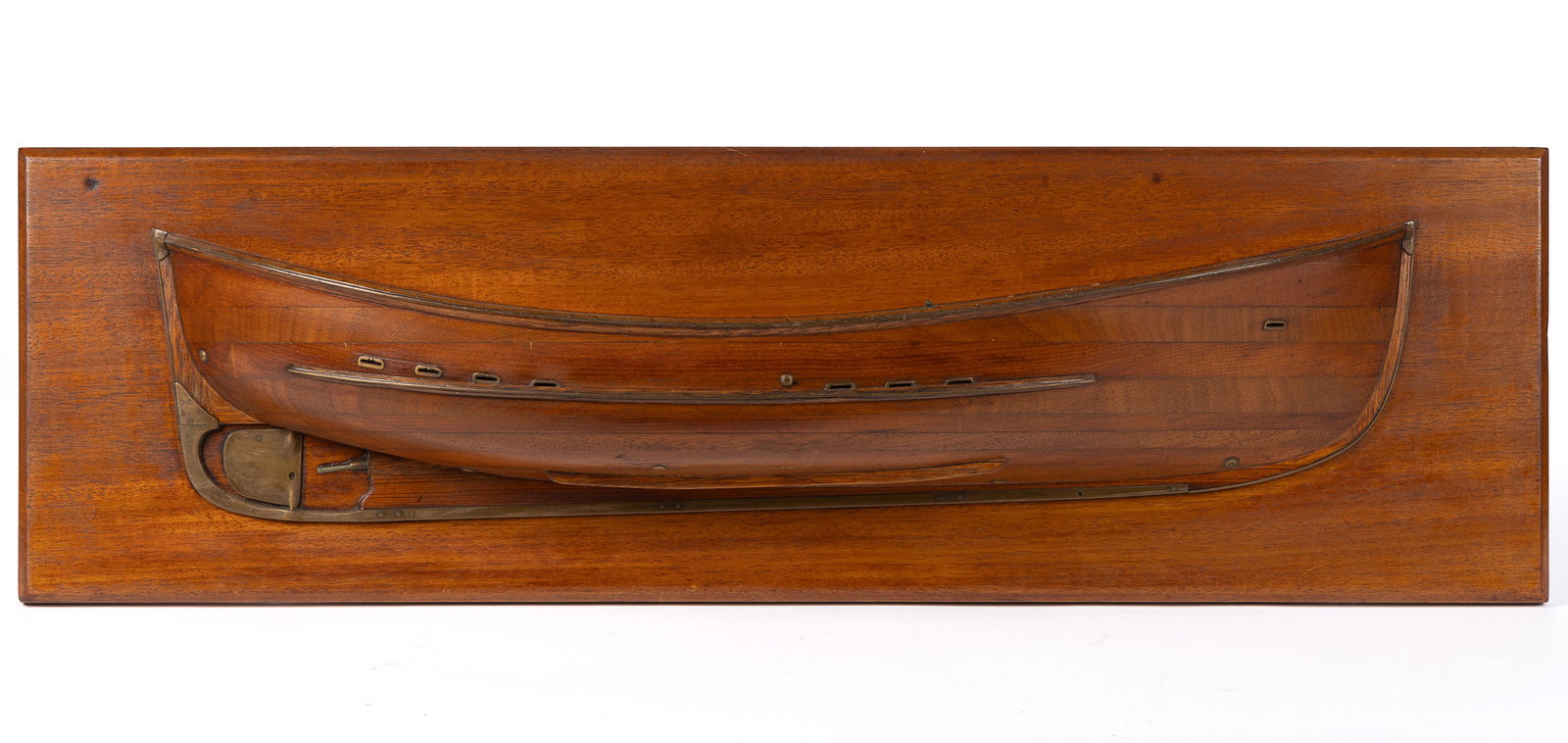 AMERICAN HALF-HULL SHIP MODEL: AMERICAN HALF-HULL SHIP MODEL, laminated mahogany and pine with brass trim, mounted on a mahogany board with chamfered edges. Retains its original surface with warm color. Late 19th/early 20th ce