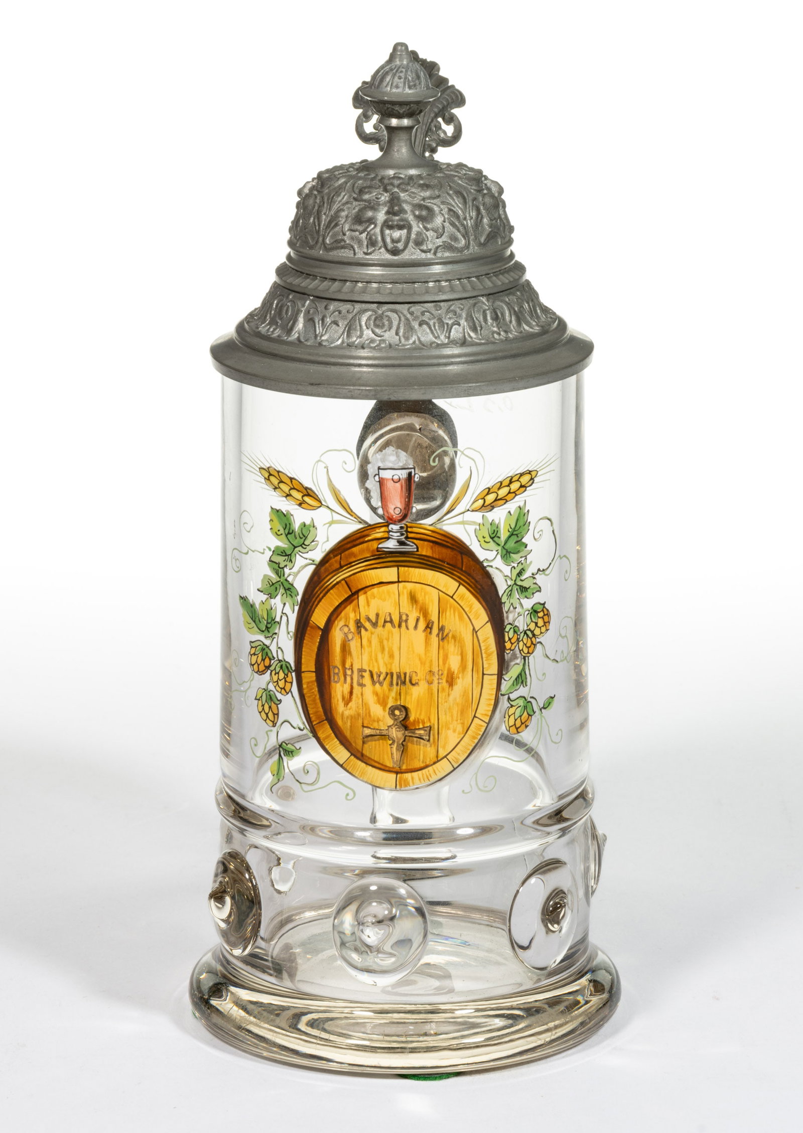 "BAVARIAN BREWING" ENAMEL-DECORATED GLASS STEIN: "BAVARIAN BREWING" ENAMEL-DECORATED GLASS STEIN, colorless, cylindrical form with a lower band of applied medallions, decoration featuring a central barrel stamped "BAVARIAN/BREWING CO.