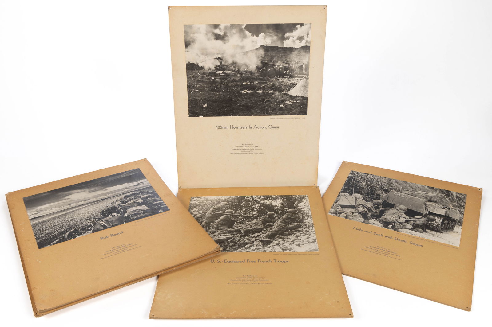 WWII U.S. MILITARY LARGE FORMAT "GRAFLEX SEES THE WAR" PHOTOGRAPHIC POSTERS, LOT OF NINE: WWII U.S. MILITARY LARGE FORMAT "GRAFLEX SEES THE WAR" PHOTOGRAPHIC POSTERS, LOT OF NINE, from a series of propaganda posters distributed to help sell War Bonds, each mounted on thick cardst