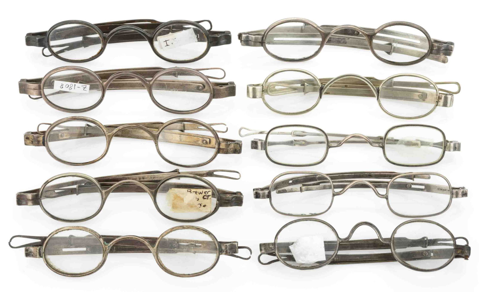CONNECTICUT COIN SILVER SPECTACLES, LOT OF TEN: CONNECTICUT COIN SILVER SPECTACLES, LOT OF TEN, each with oval lenses, sliding-pin or telescoping extension temples, arched or scrolling bridges, marks comprising: "J.C. POR__ / HARTFORD&quo
