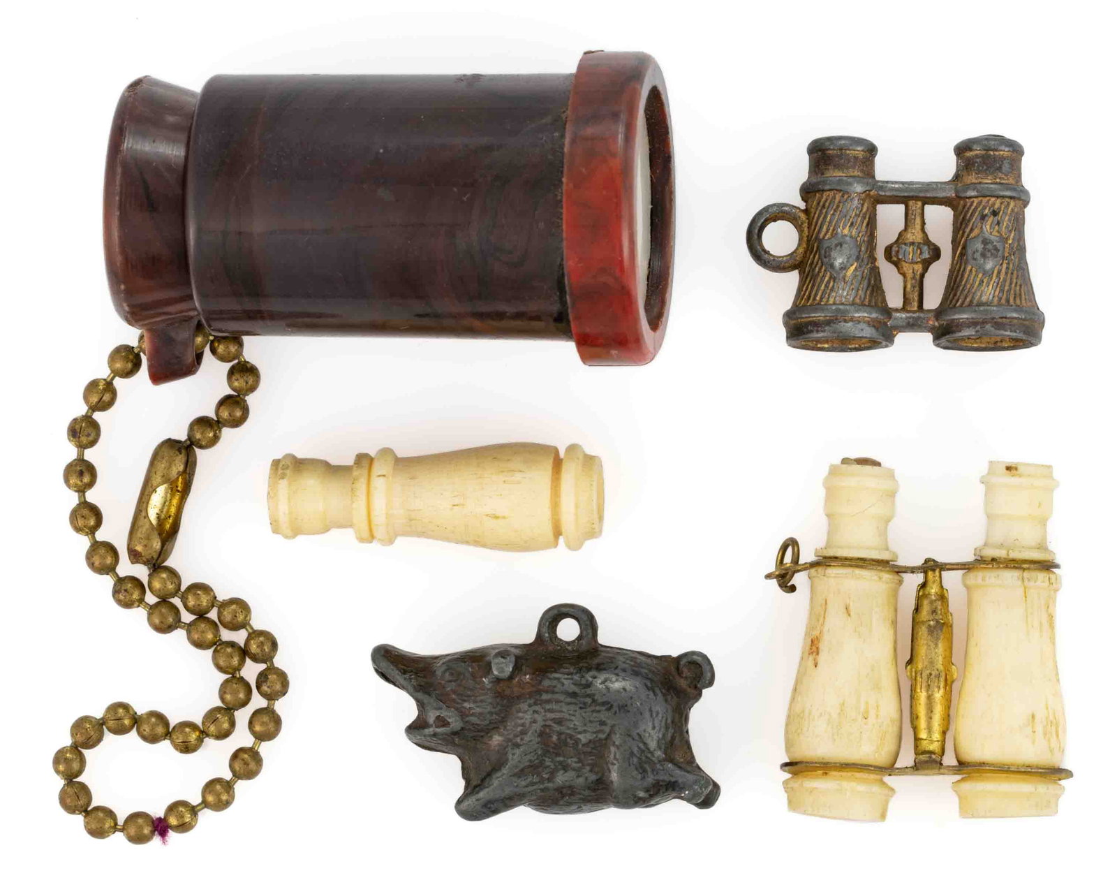 ANTIQUE AND VINTAGE RISQUE / NUDE STANHOPE AND VIEWER FOBS, LOT OF FIVE: ANTIQUE AND VINTAGE RISQUE / NUDE STANHOPE AND VIEWER FOBS, LOT OF FIVE, comprising a pig-form example with a stanhope featuring a completely nude woman, a pair of metal binoculars with two stanh