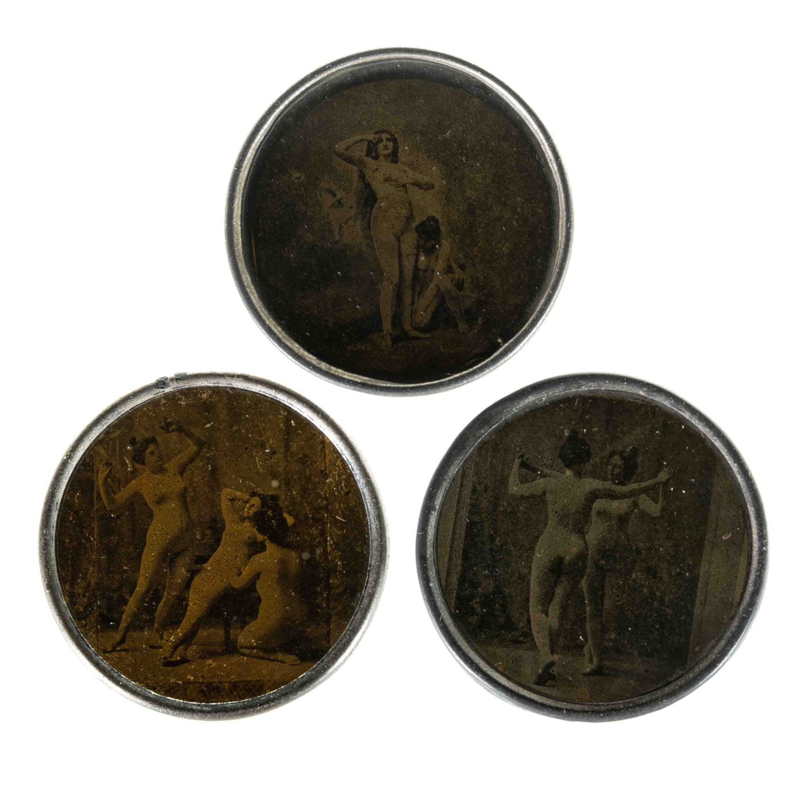 VICTORIAN RISQUE NUDE HIDDEN IMAGE POCKET MIRRORS, LOT OF THREE: VICTORIAN RISQUE NUDE HIDDEN IMAGE POCKET MIRRORS, LOT OF THREE, round tin/pewter frames embossed at outer edge with variations of "HOWE'S PAT APP'D FOR / OUT OF SIGHT" and "TRA