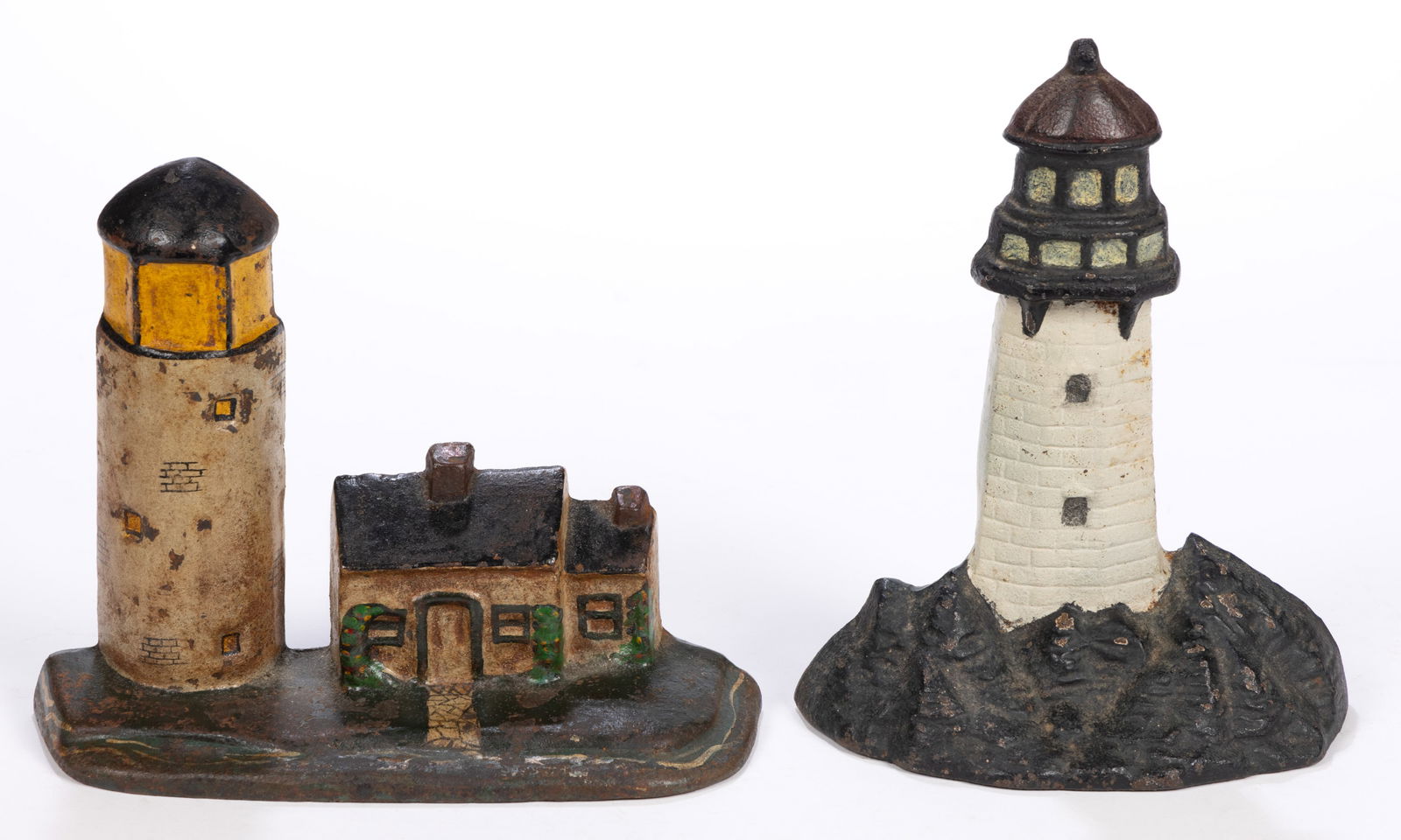 NATIONAL FOUNDRY AND OTHER LIGHTHOUSE CAST-IRON DOORSTOPS, LOT OF TWO: NATIONAL FOUNDRY AND OTHER LIGHTHOUSE CAST-IRON DOORSTOPS, LOT OF TWO, polychrome painted cast-iron, hollow backs, one example showing the house beside the lighthouse and a lawn with painted walk, the