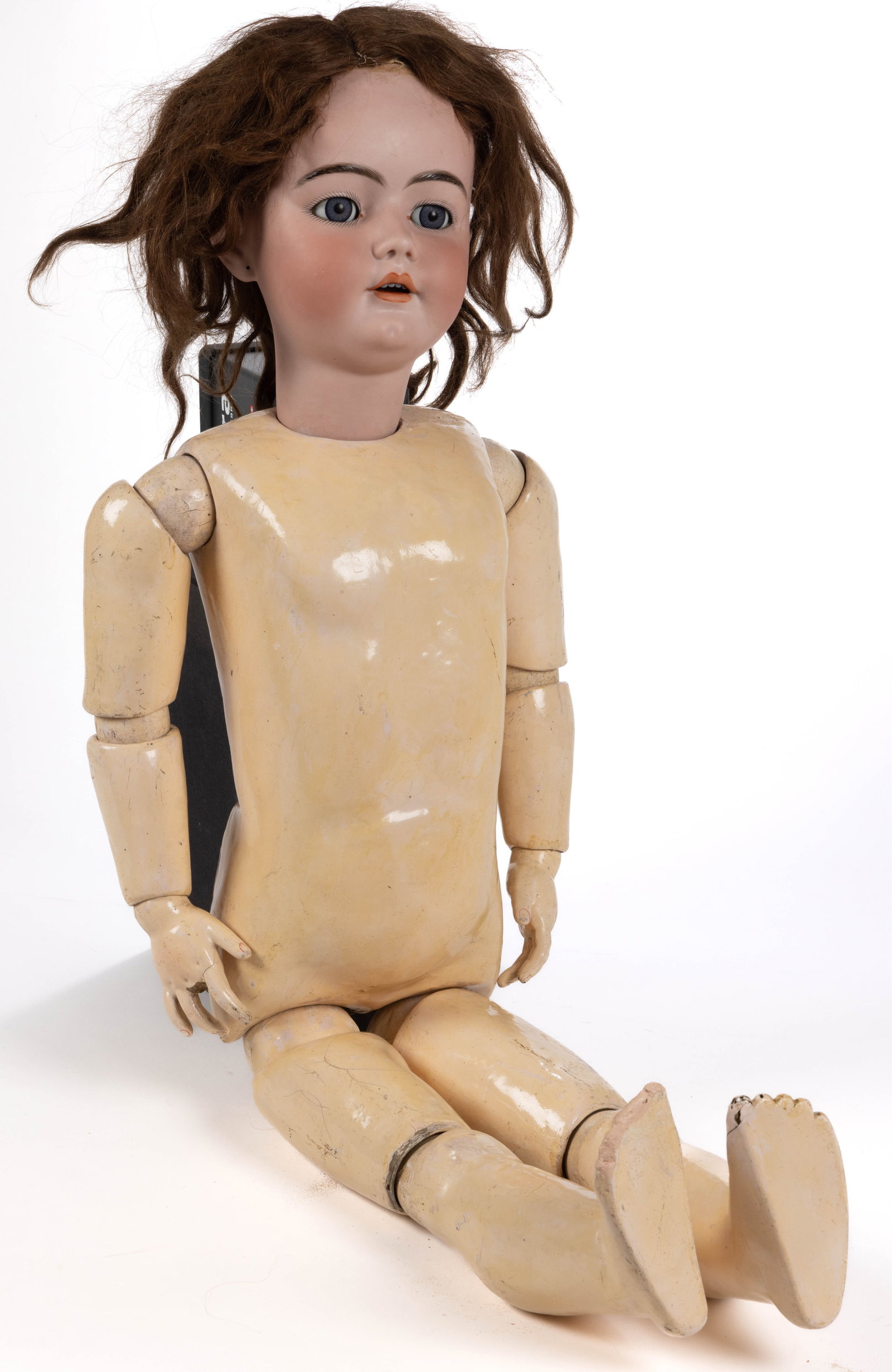 GERMAN HEINRICH HANDWERCK BISQUE-HEAD AND COMPOSITION 42 INCH DOLL: GERMAN HEINRICH HANDWERCK BISQUE-HEAD AND COMPOSITION 42-INCH DOLL, socket head, reverse incised "HANDWERCK / 9", sleepy blue eyes, hand-painted facial features including lightly molded eyeb