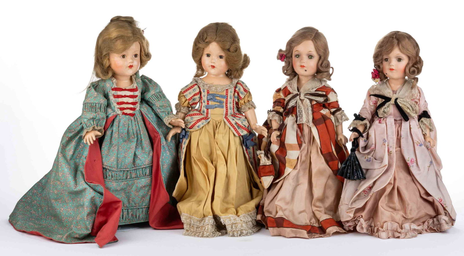 ASSORTED COMPOSITION GIRL DOLLS, LOT OF FOUR: ASSORTED COMPOSITION GIRL DOLLS, LOT OF FOUR, painted facial decorations, composition bodies with jointed shoulders and hips, light brown hair wigs, comprising two Historical series Effanbee exam