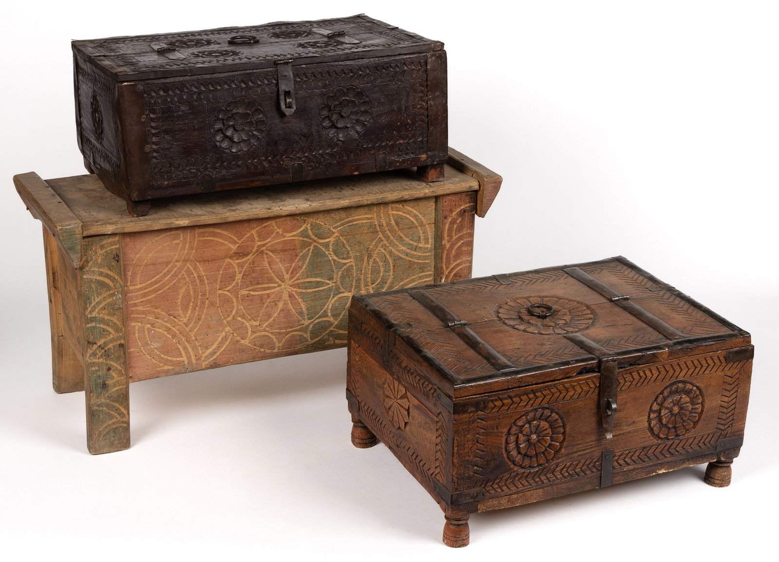 WOODEN COUNTRY CHIP-CARVED BOXES, LOT OF THREE: WOODEN COUNTRY CHIP-CARVED BOXES, LOT OF THREE, comprising two examples with metal edging and a lid hinged in the middle of the top; an example with a carved pinwheel design to the front. 20