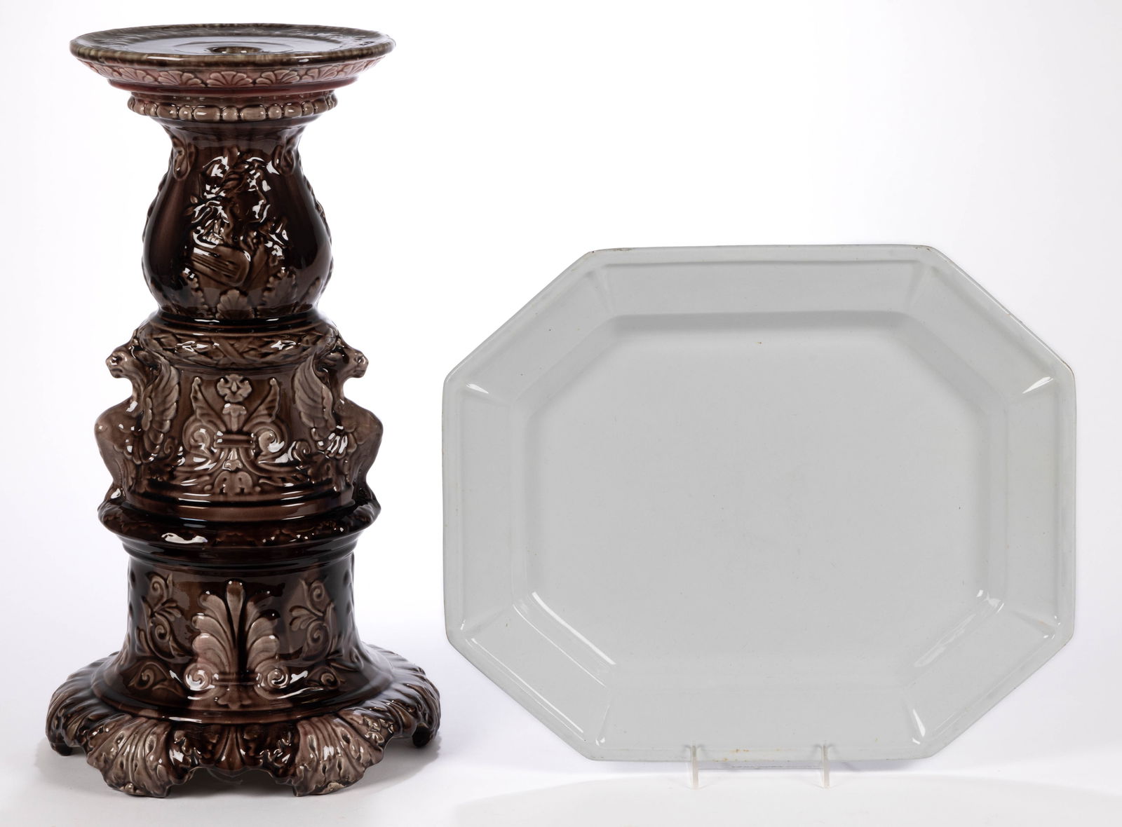 AMERICAN MAJOLICA ART POTTERY PEDESTAL: AMERICAN MAJOLICA ART POTTERY PEDESTAL, mottled brown and rose glaze, features images including a profile of a classical woman with a harp, two mythical winged beasts to medial section, and scrol