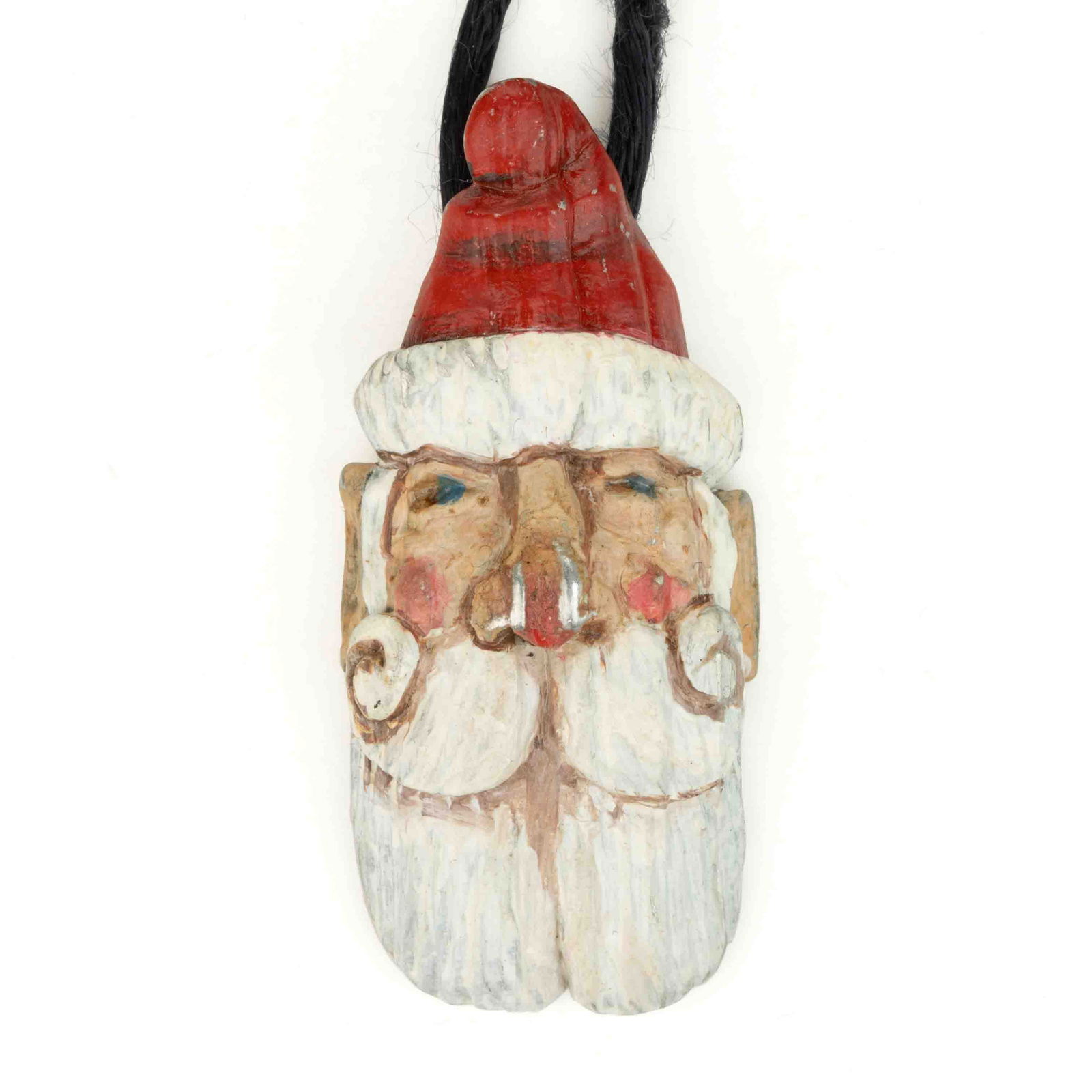 JOHN L. HEATWOLE (1948-2006), SHENANDOAH VALLEY OF VIRGINIA, CAST PEWTER PENDANT: JOHN L. HEATWOLE (1948-2006), SHENANDOAH VALLEY OF VIRGINIA, CAST PEWTER PENDANT, polychrome painted Santa Claus mask, back with hanging loop and "JLH". Circa 1990. 2" H. Catalogue Note