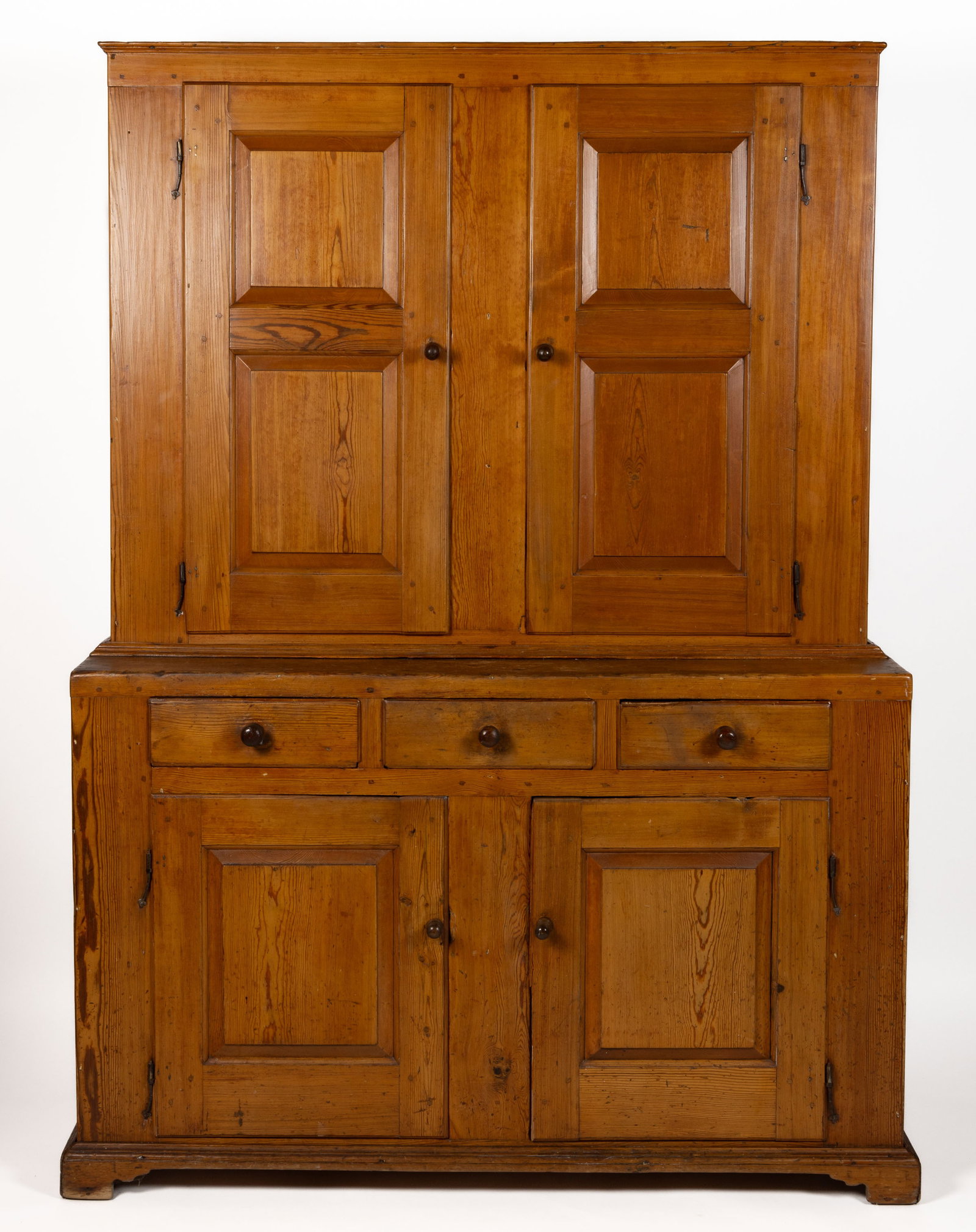 SHENANDOAH VALLEY OF VIRGINIA YELLOW PINE STEPBACK CUPBOARD: SHENANDOAH VALLEY OF VIRGINIA YELLOW PINE STEPBACK CUPBOARD, two-piece construction, upper case with two raised panel doors and solid ends, lower case with short drawers above two raised panelled door
