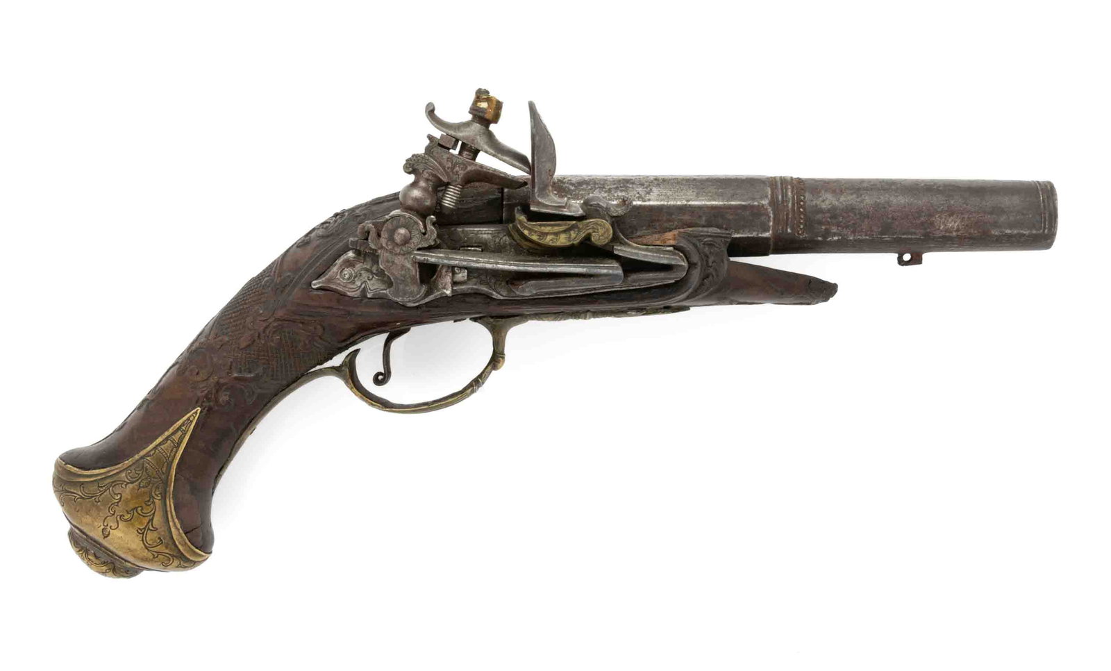 ANTIQUE FRENCH FLINTLOCK PISTOL: ANTIQUE FRENCH FLINTLOCK PISTOL, approximately 59 cal., round to octagonal barrel, engraved brass pan, trigger guard, buttcap, and pierced side plate, finely carved stock. Class: Antique. 18th century
