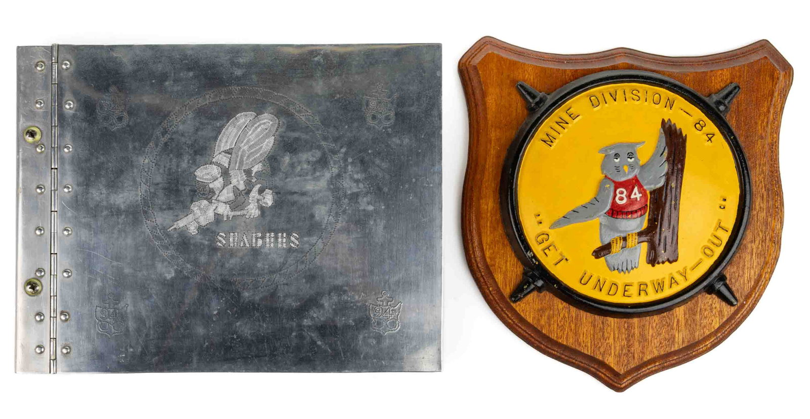UNITED STATES NAVY PLAQUE AND TRENCH ART, LOT OF TWO: UNITED STATES NAVY PLAQUE AND TRENCH ART, LOT OF TWO, comprising a Seebees 94th Construction Battalion aluminum trench art hinged log cover with decoration on both sides; and a painted-metal plaque fo