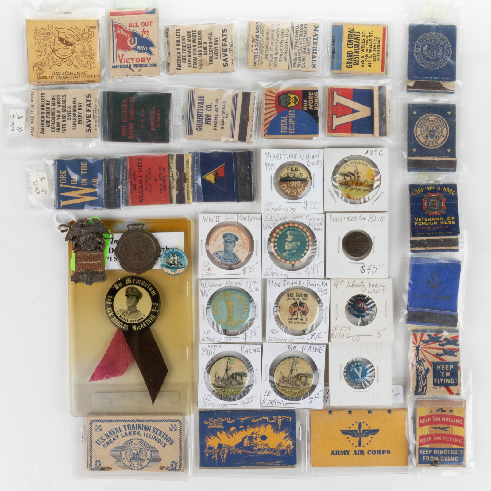 WORLD WAR II / WWII AND OTHER MILITARY EPHEMERA, UNCOUNTED LOT: WORLD WAR II / WWII AND OTHER MILITARY EPHEMERA, UNCOUNTED LOT, including WWII matchbooks; a Spanish-American War watch fob; two Battleship Maine pinbacks; Gen. MacArthur and Pershing pinbacks; plus o