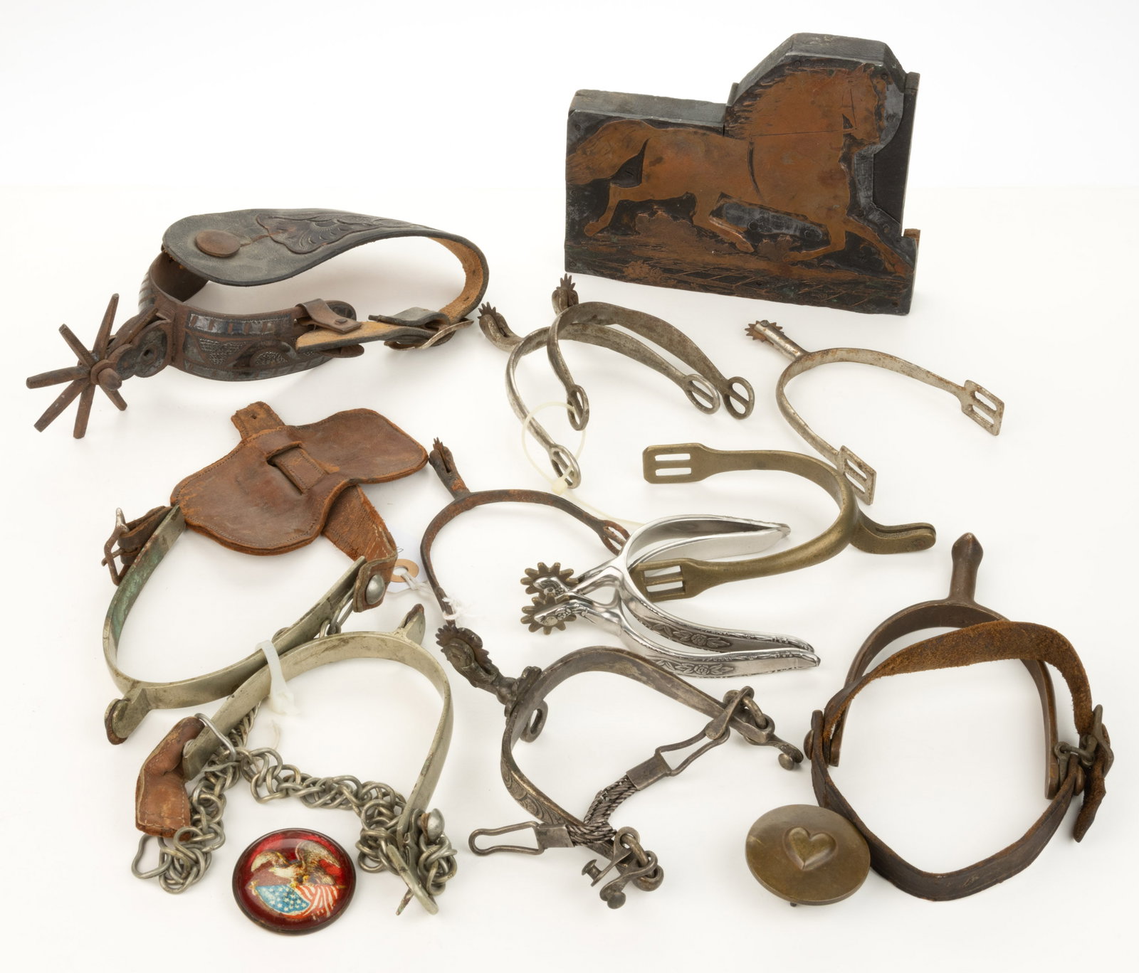 ASSORTED SPURS AND OTHER EQUINE ACCOUTREMENTS, LOT OF 15: ASSORTED SPURS AND OTHER EQUINE ACCOUTREMENTS, LOT OF 15, including a Civil War era spur dug at the Port Republic Battlefield; a Civil War era brass spur, possibly Confederate; a single spur with