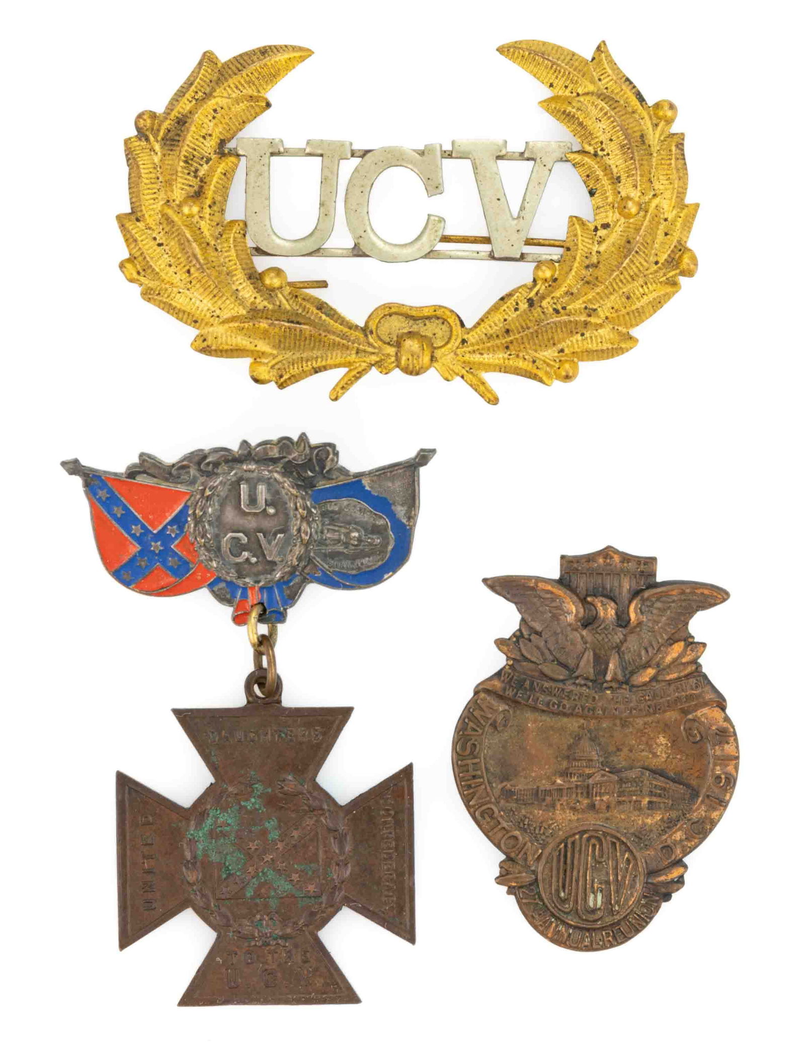 UNITED CONFEDERATE VETERANS / U.C.V. ARTICLES, LOT OF THREE: UNITED CONFEDERATE VETERANS / U.C.V. ARTICLES, LOT OF THREE, comprising a 1917 Washington, DC Reunion badge; a Southern Cross of Honor cross hung on a U.C.V. pin; and a "UCV" hat badge.