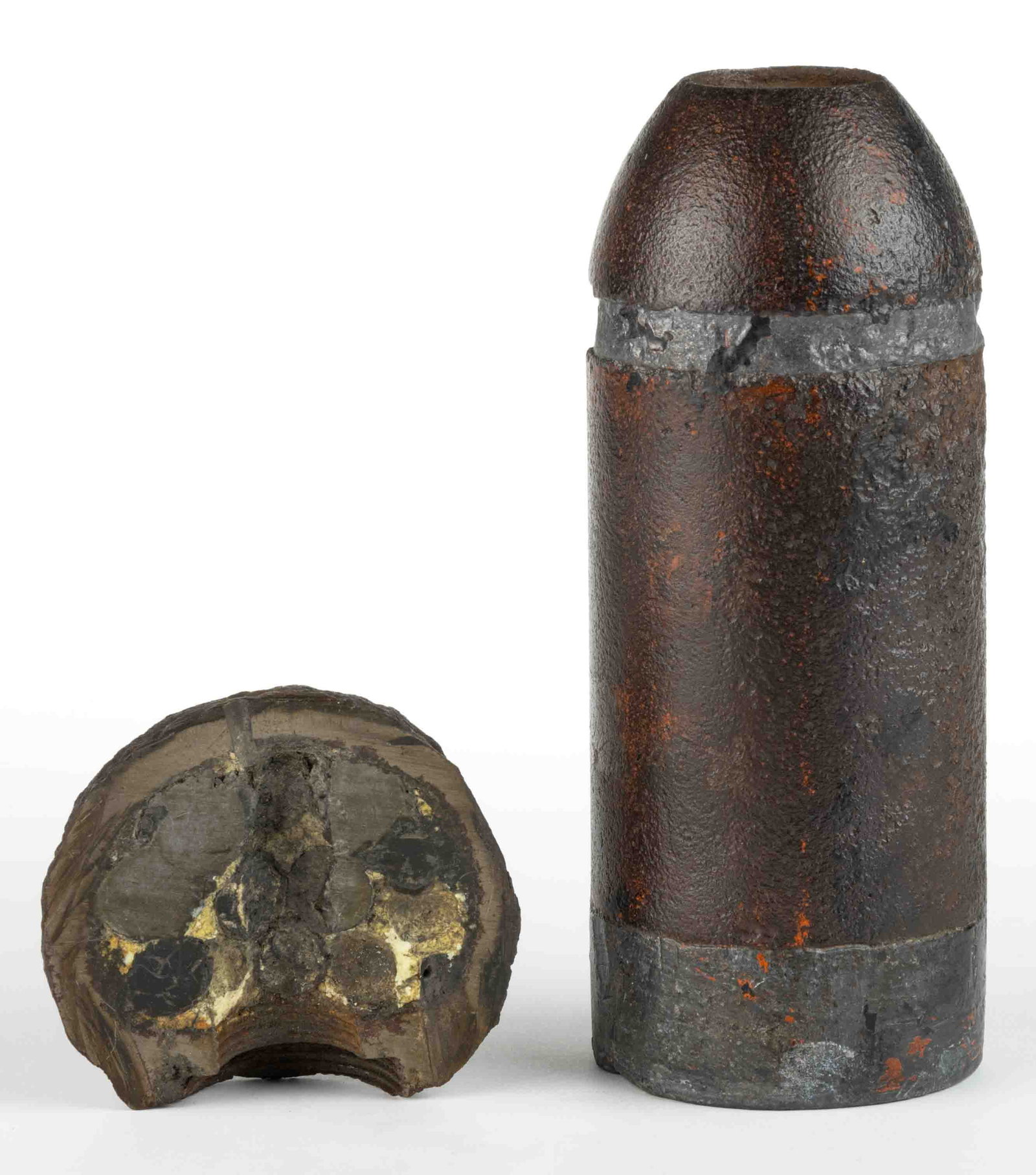 CIVIL WAR ERA ARTILLERY SHELLS, LOT OF TWO: CIVIL WAR ERA ARTILLERY SHELLS, LOT OF TWO, comprising an Absterdam pattern with an 1862 patent date to the underside, and a cross-section of a Confederate spherical. Circa 1860. 7 1/2" H, 2 7/8&
