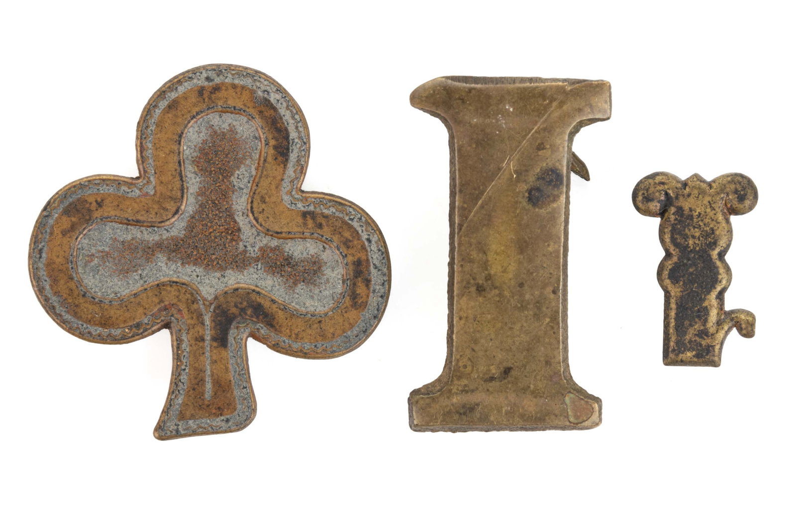 CIVIL WAR BRASS INSIGNIA, LOT OF THREE: CIVIL WAR BRASS INSIGNIA, LOT OF THREE, comprising a frame-style 1st Division, 2nd Army Corps badge; a "1" insignia; and an "I" insignia, each with rear hooks. Circa 1860. 3/4"