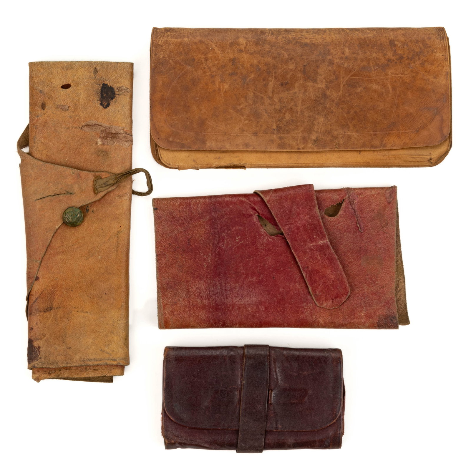 CIVIL WAR-ERA LEATHER WALLETS, LOT OF FOUR: CIVIL WAR-ERA LEATHER WALLETS, LOT OF FOUR, comprising two folding accordion type and two roll-up type, one having a Civil War brass eagle sleeve button used for the clasp and with provenance of being