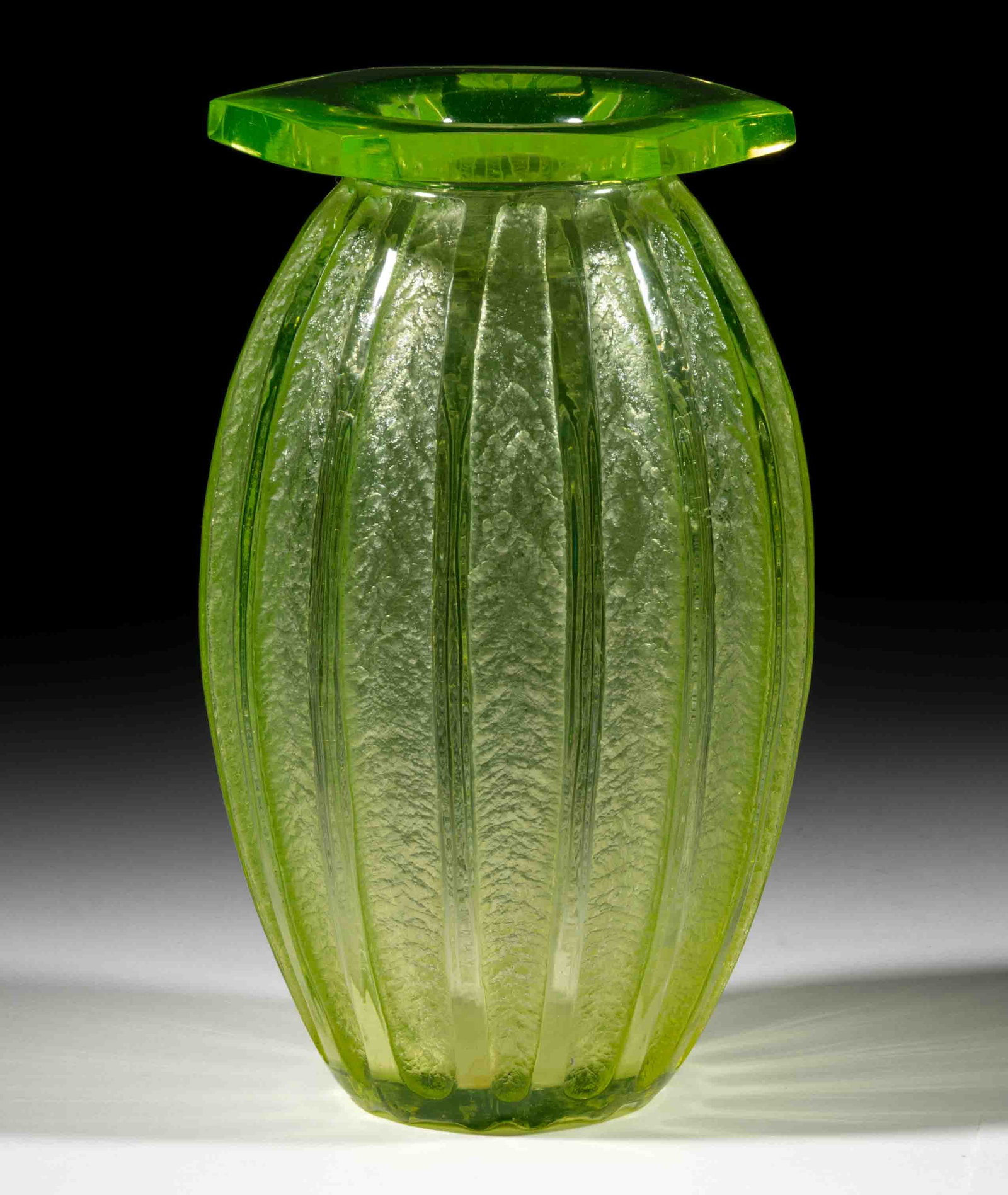 DAUM ART-DECO ACID-ETCHED ART GLASS VASE: DAUM ART-DECO ACID-ETCHED ART GLASS VASE, uranium/Vaseline (reacts under black light), having 15 vertical ribs and columns of etched decoration, flattened rim, signed around the base edge, "DAUM
