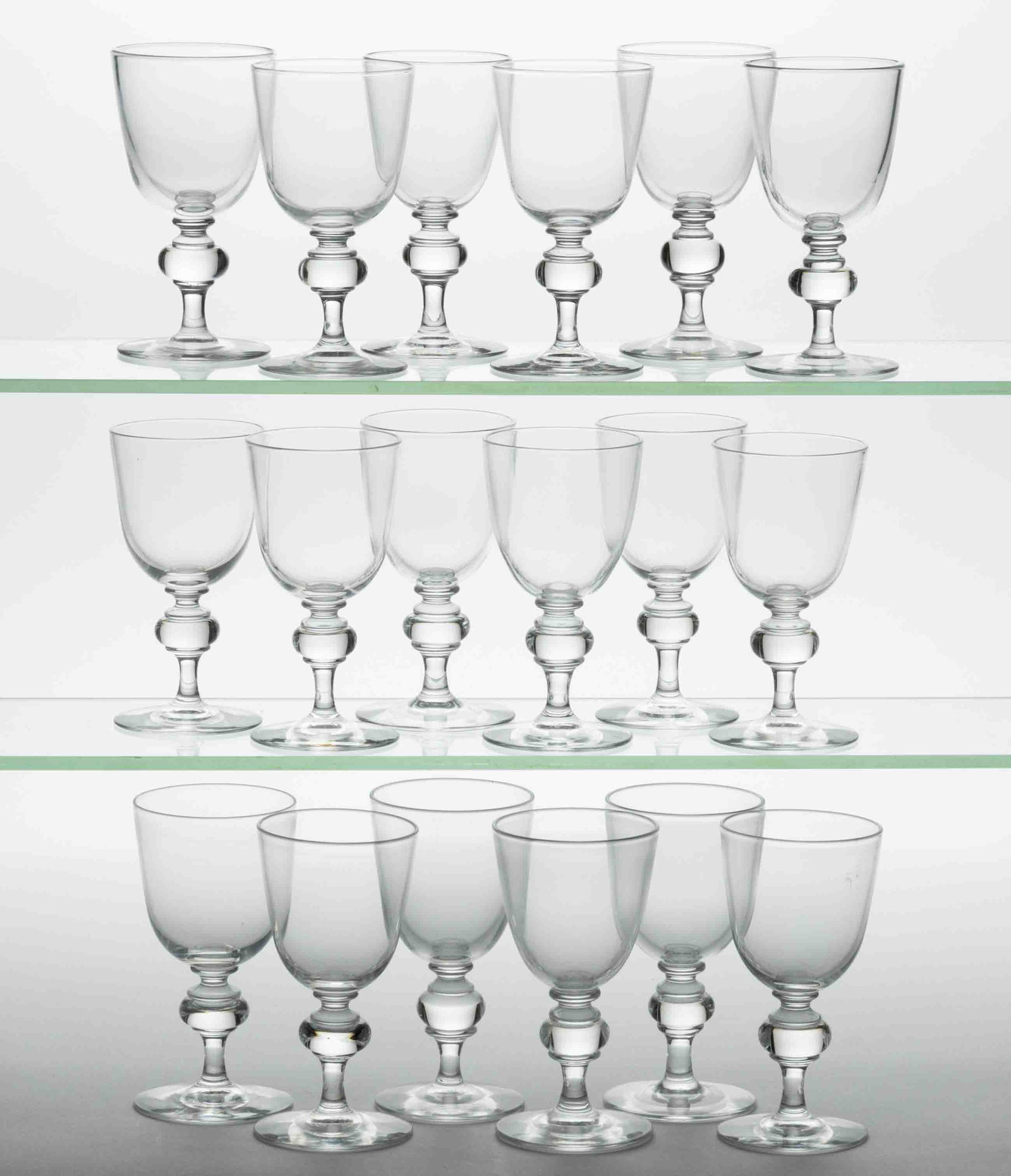 STEUBEN NO. 7925 CRYSTAL ART GLASS WHITE WINE GLASSES, LOT OF 18: STEUBEN NO. 7925 CRYSTAL ART GLASS WHITE WINE GLASSES, LOT OF 18, colorless, each signed to the underside. Steuben Glass Works. 20th century. 4 3/4" to 4 7/8" H. Provenance: From a Ma