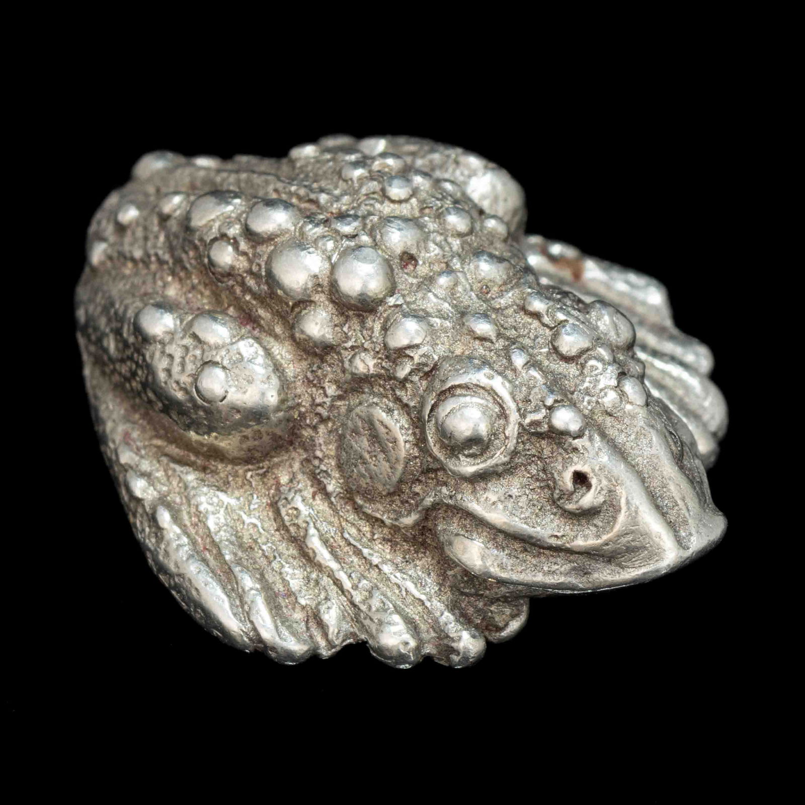 JOHN L. HEATWOLE (1948-2006), SHENANDOAH VALLEY OF VIRGINIA, CAST-PEWTER FIGURE: JOHN L. HEATWOLE (1948-2006), SHENANDOAH VALLEY OF VIRGINIA, CAST-PEWTER FIGURE, titled "Worry Wart", depicting a wart-covered toad, signed "JLH" to the underside. Circa 1990.