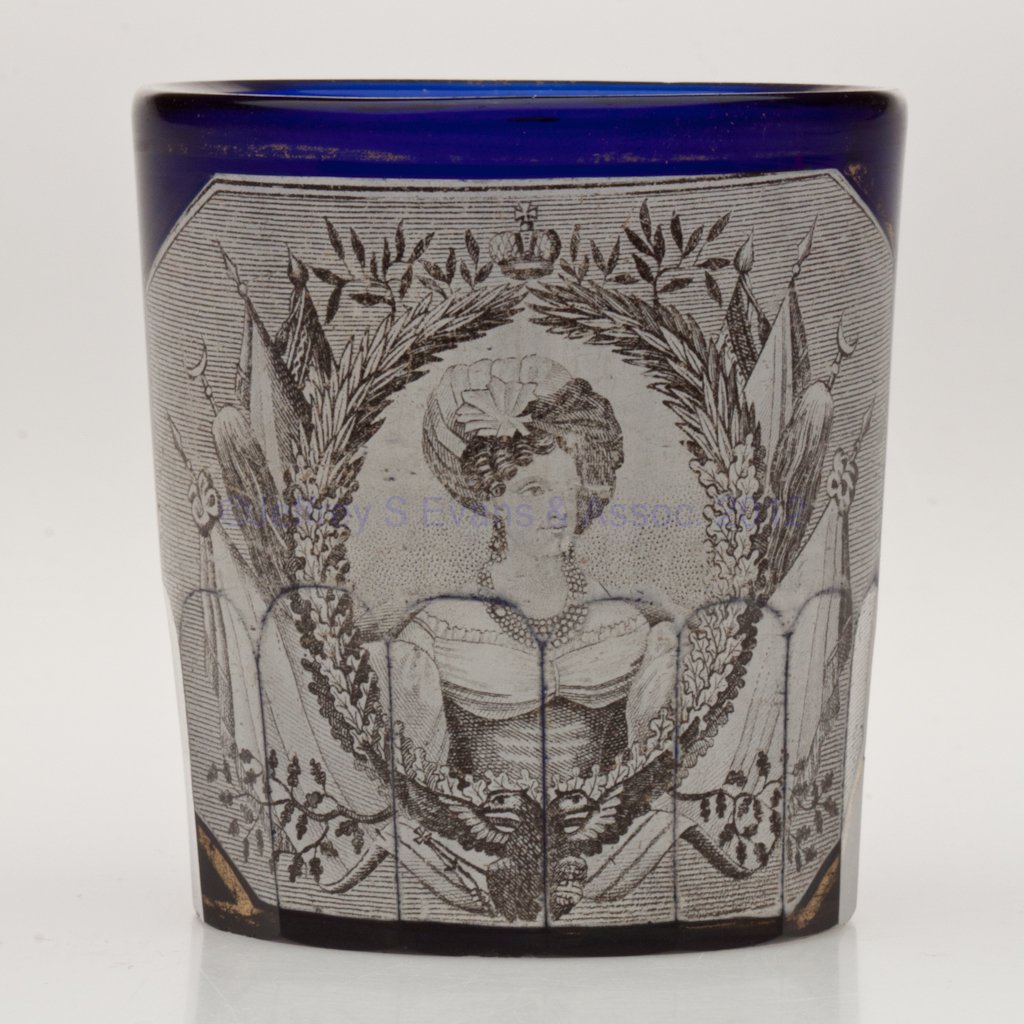 RUSSIAN HISTORICAL GLASS BEAKER: RUSSIAN HISTORICAL GLASS BEAKER, cobalt blue, featuring a transfer print depicting Alexandra Fedorovna backed with silver and gilt floral decorations. Attributed to the Imperial Glass Factory, St. Pet