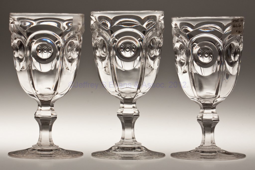BULL'S EYE - GROOVED-KNOP STEM GOBLETS, LOT OF THR: BULL'S EYE - GROOVED-KNOP STEM GOBLETS, LOT OF THREE, colorless lead glass. Third quarter 19th century. 6 1/2" to 6 3/4" H. Provenance: Lillian "Lil" and Walter "Bud" Marchant Collection/Lil-Bud Antiq