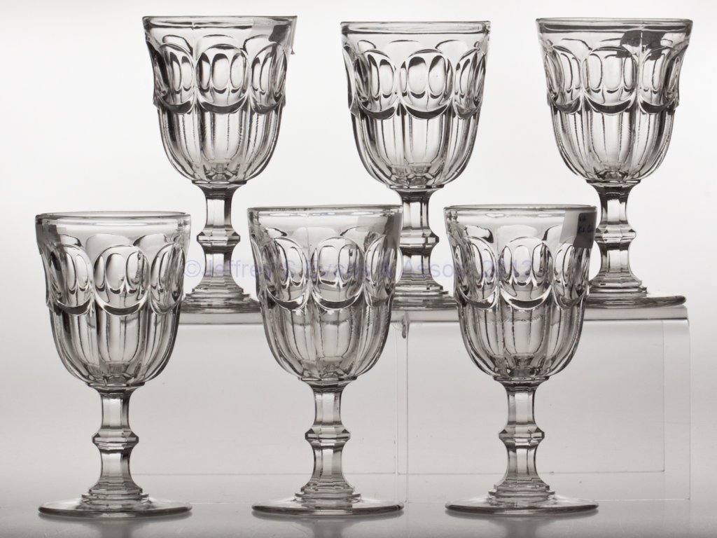 COLONIAL - KNOP STEM ASSEMBLED SET OF SIX GOBLETS: COLONIAL - KNOP STEM ASSEMBLED SET OF SIX GOBLETS, colorless lead glass. Third quarter 19th century. 6 1/8" and 6 1/4" H. Provenance: Lillian "Lil" and Walter "Bud" Marchant Collection/Lil-Bud Antique