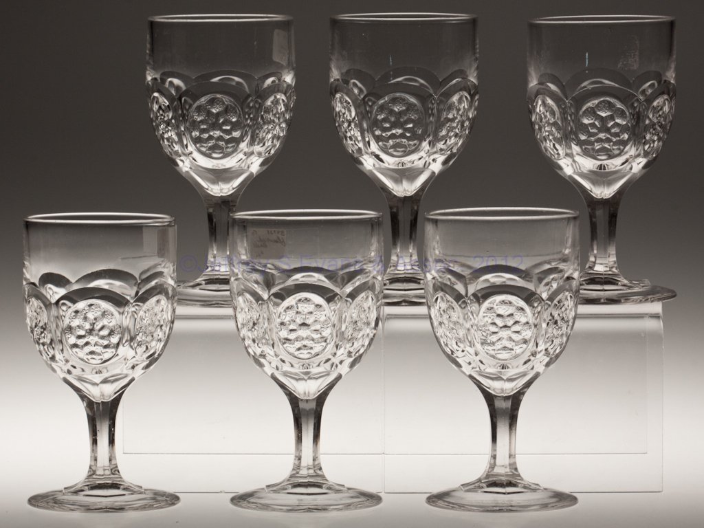 FLOWER MEDALLION SET OF SIX GOBLETS: FLOWER MEDALLION SET OF SIX GOBLETS, colorless lead glass. Third quarter 19th century. 6 1/8" H. Provenance: Lillian "Lil" and Walter "Bud" Marchant Collection/Lil-Bud Antiques. One example JSE&A/GVA,