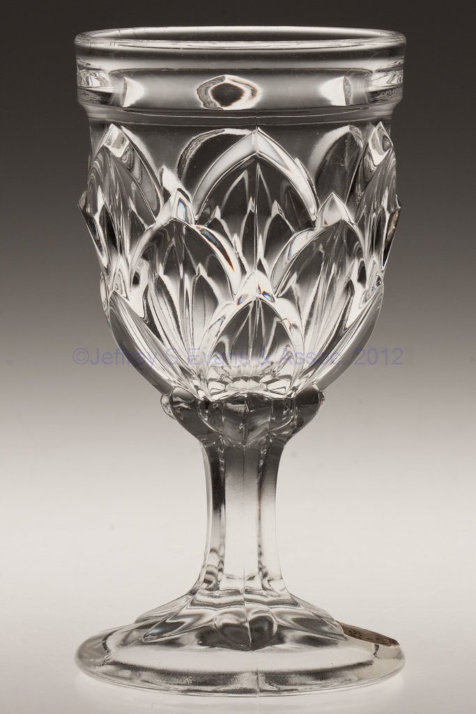 LAMINATED PETALS CHAMPAGNE GLASS: LAMINATED PETALS CHAMPAGNE GLASS, colorless lead glass. Third quarter 19th century. 5 1/4" H. Collection of Walter "Bud" Marchant.