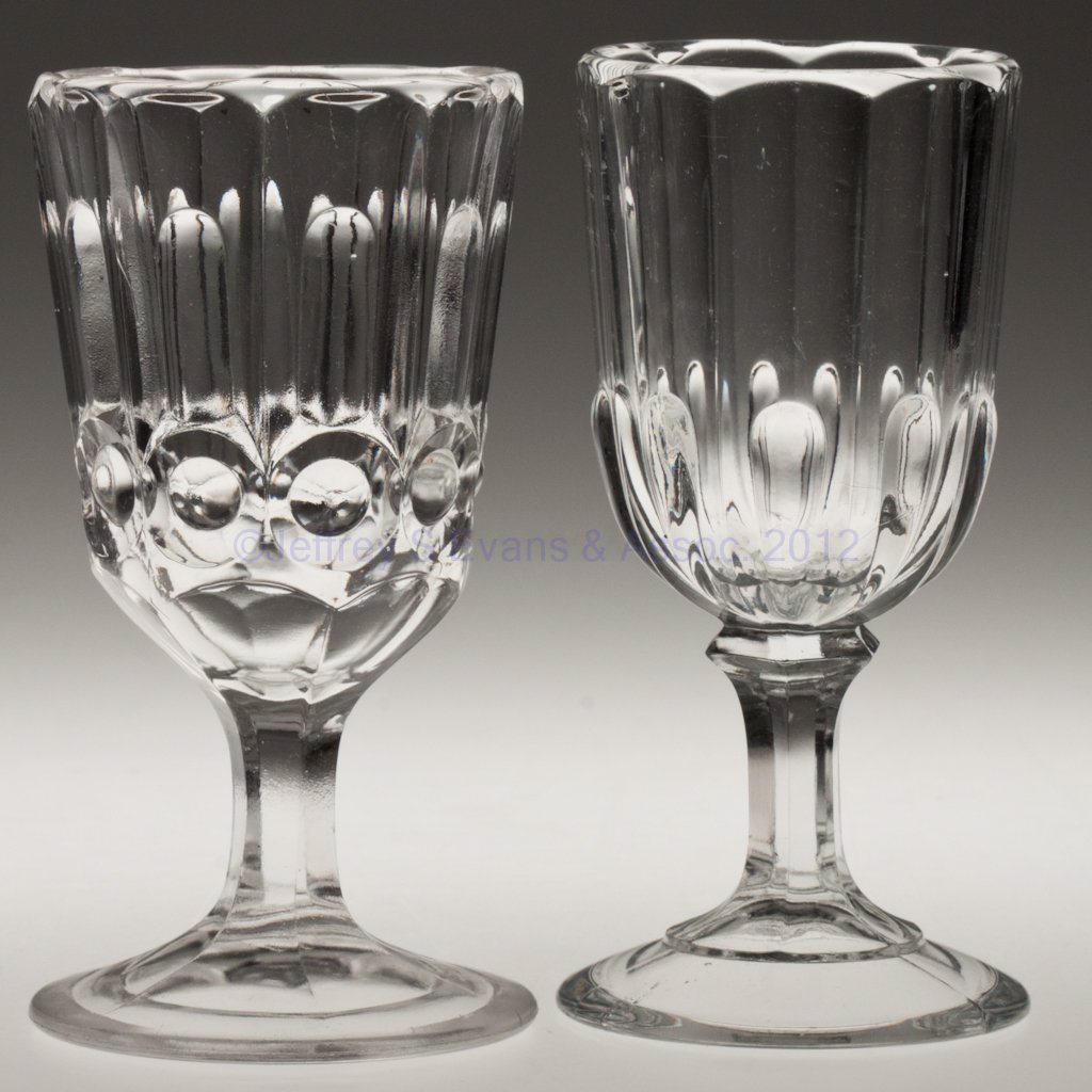 VARIOUS EAPG CHAMPAGNE GLASSES, LOT OF TWO: VARIOUS EAPG CHAMPAGNE GLASSES, LOT OF TWO, colorless lead glass, comprising Pillar and Bull's Eye, and Pillared Crystal. Third quarter 19th century. 5 1/8" H. Collection of Walter "Bud" Marchant