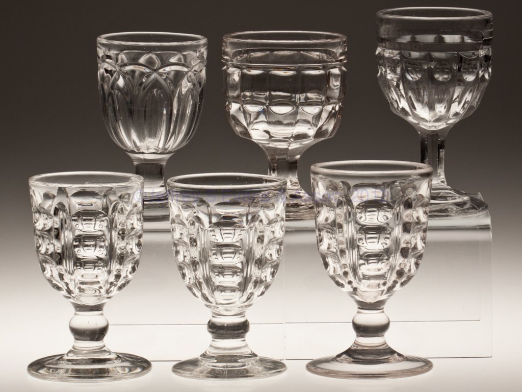 VARIOUS EAPG GOBLETS, LOT OF SIX: VARIOUS EAPG GOBLETS, LOT OF SIX, colorless lead glass, including three Master Argus with various stem treatments. Third quarter 19th century. 5 1/8" to 5 7/8" H. Provenance: Lillian "Lil" and Walter 