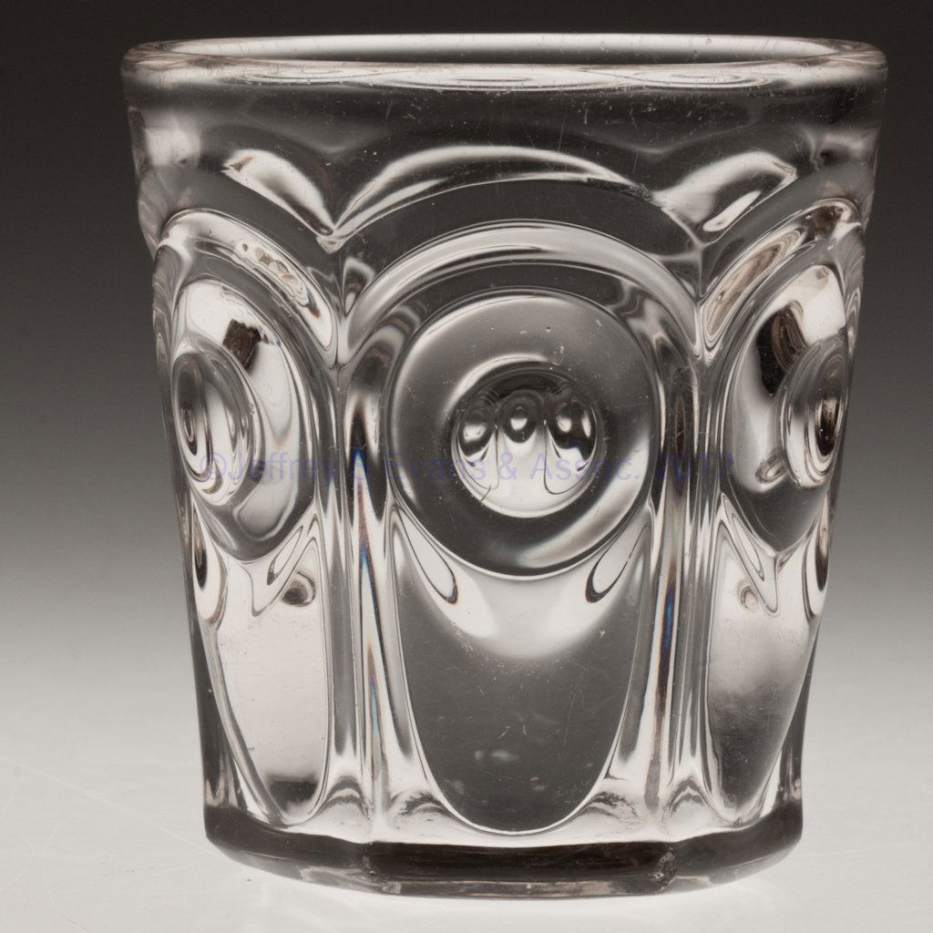 BULL'S EYE WATER TUMBLER: BULL'S EYE WATER TUMBLER, colorless lead glass with slight yellowish tint and low resonance, faint rough pontil mark. Third quarter 19th century. 3 1/2" H.Provenance: Lillian "Lil" and Walter "Bud" Ma