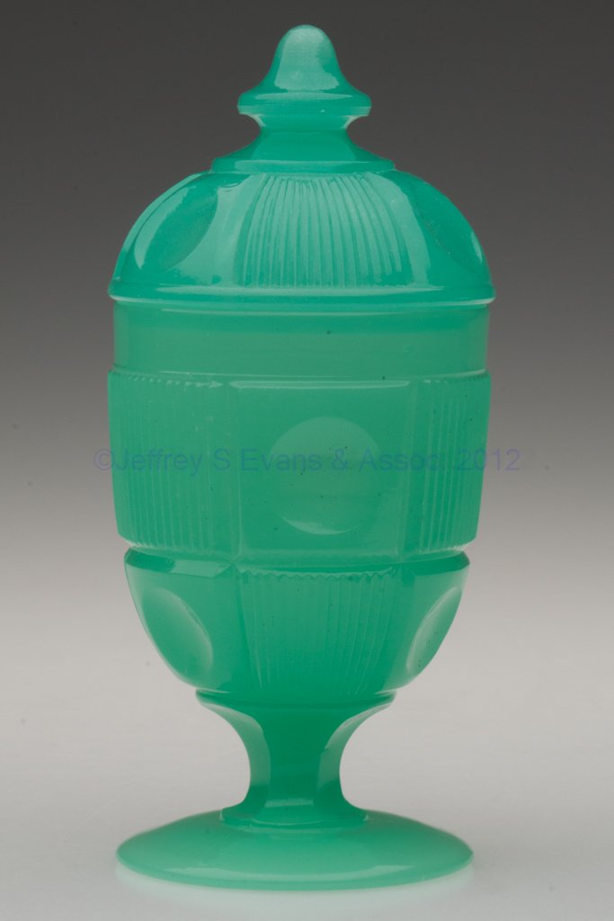 BULL'S EYE AND BAR COVERED EGG CUP / POMADE: BULL'S EYE AND BAR COVERED EGG CUP / POMADE, translucent jade green, cover with an acorn-form finial. Boston & Sandwich Glass Co. and probably others. Third quarter 19th century. 5 3/8" HOA, 2 1/2" D 