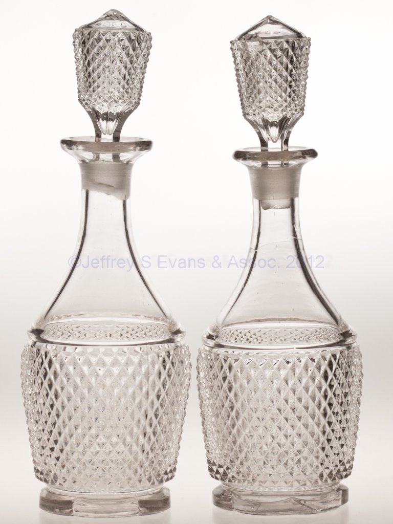 DIAMOND POINT / SHARP DIAMOND (OMN) PAIR OF QUART : DIAMOND POINT / SHARP DIAMOND (OMN) PAIR OF QUART DECANTERS, colorless lead glass, each with matching stopper, six-scallop base, and a polished pontil mark. Third quarter 19th century. 13 1/4" HOA, 3 