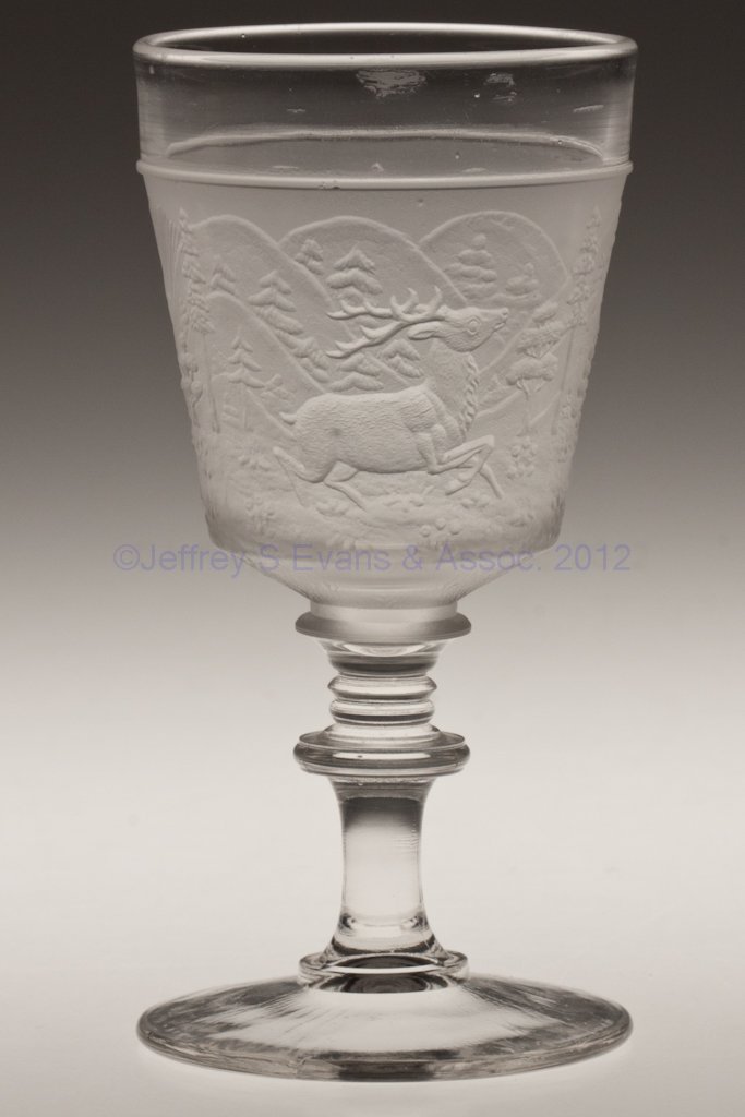 WESTWARD HO CHAMPAGNE GLASS: WESTWARD HO CHAMPAGNE GLASS, colorless and frosted. Gillinder & Sons. Fourth quarter 19th century. 5" H. Provenance: Personal collection of Judith (Judy) Cronin, Orleans, MA.